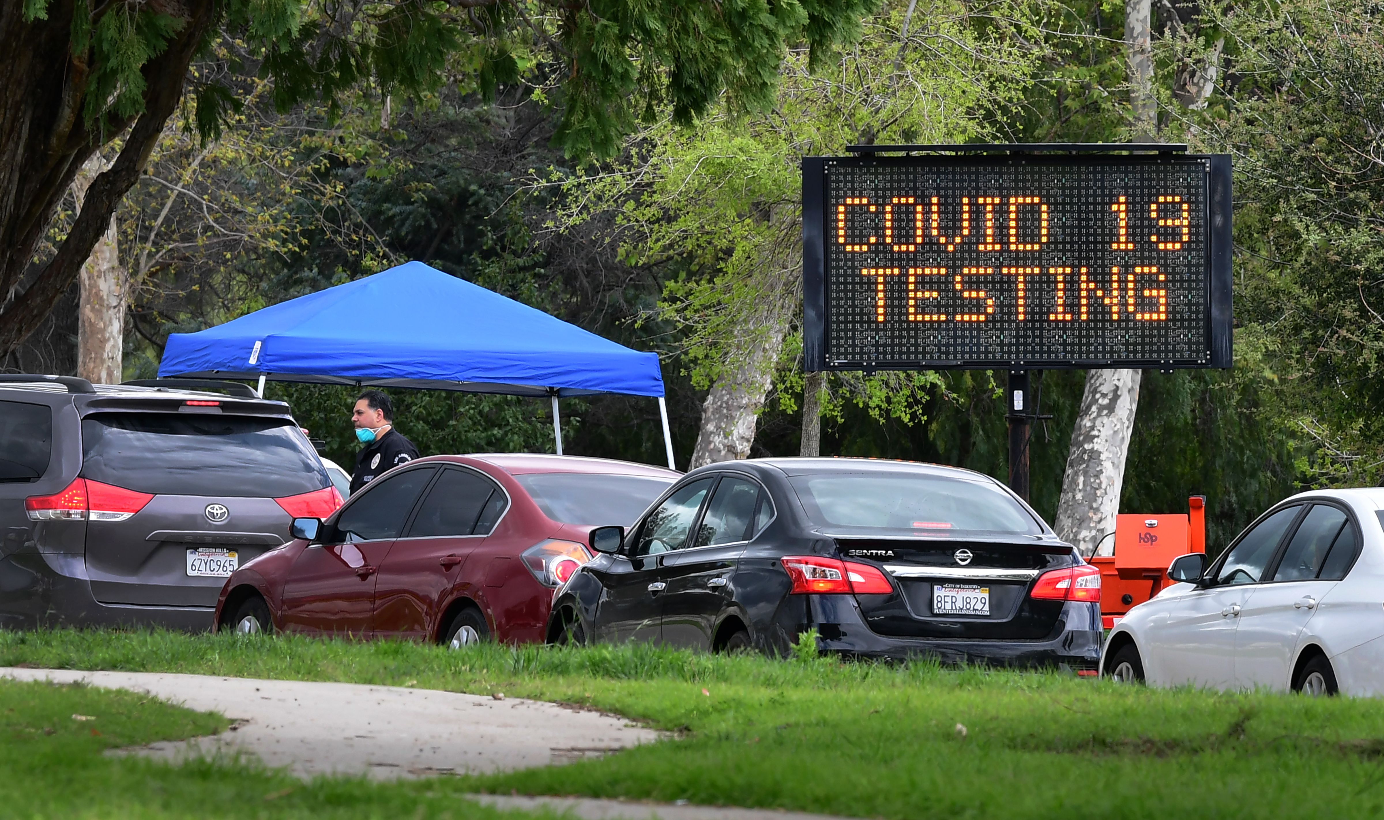 Cars wait at drive-thru Coronavirus testing