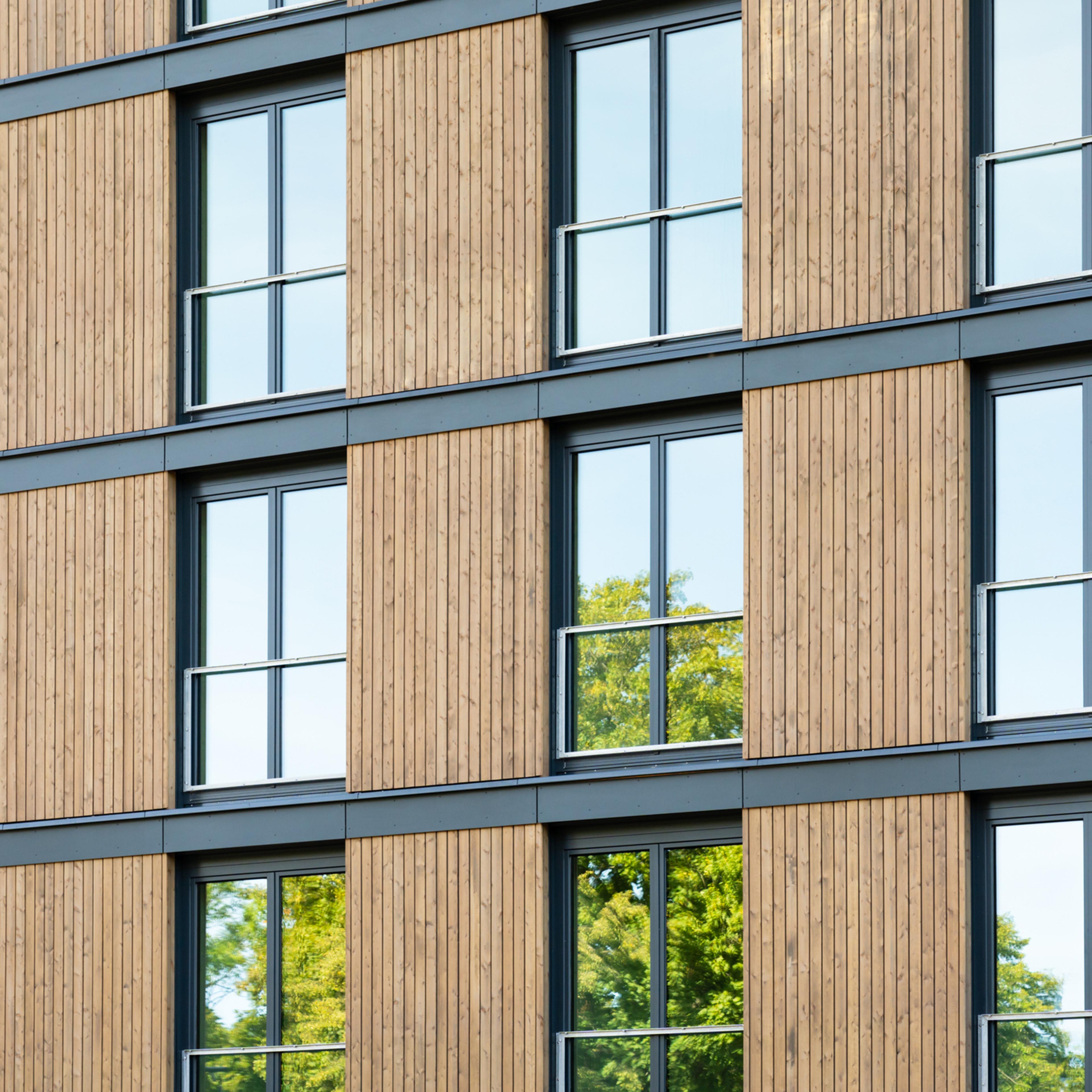 Apartment building with a wood facade.