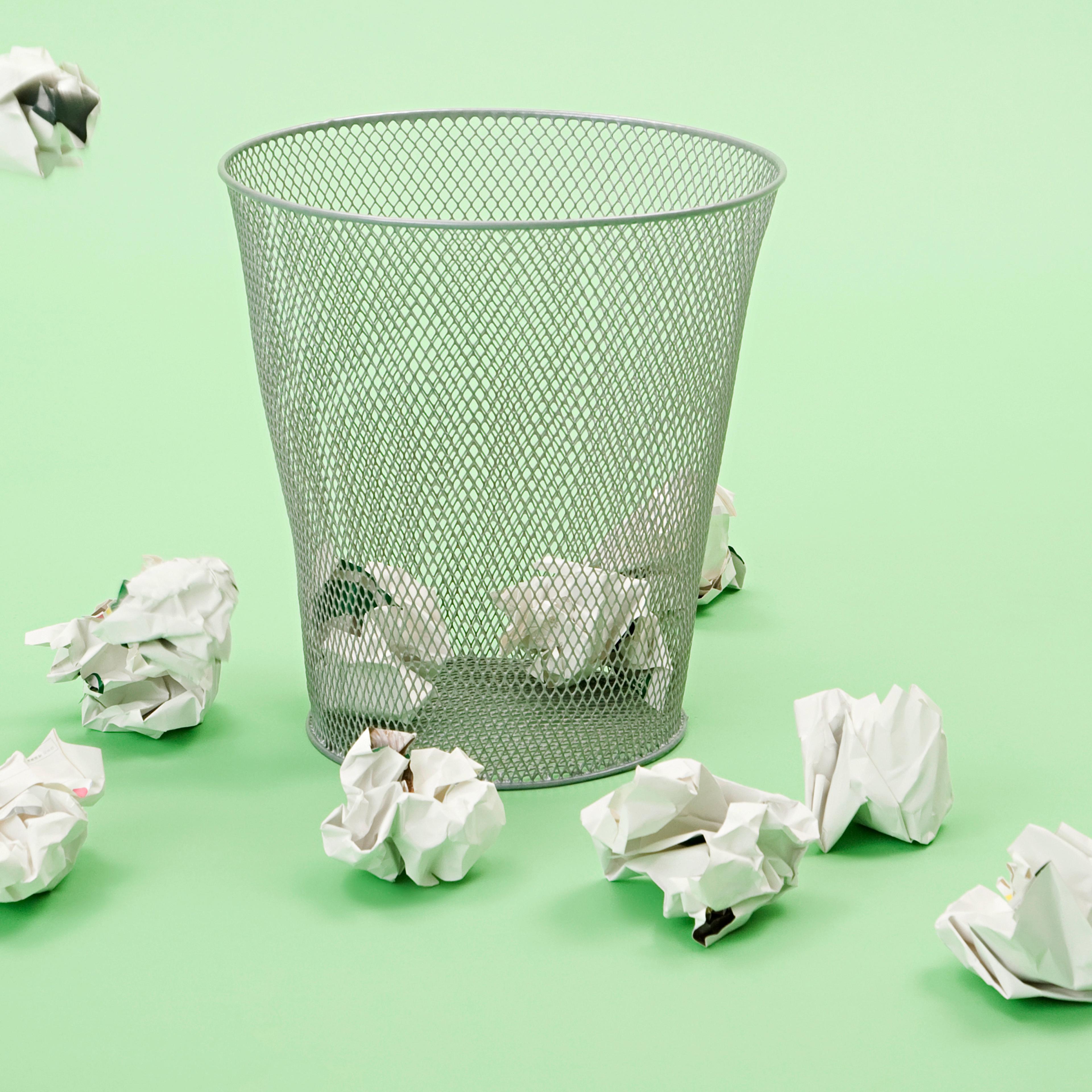 Paper getting thrown into a bin