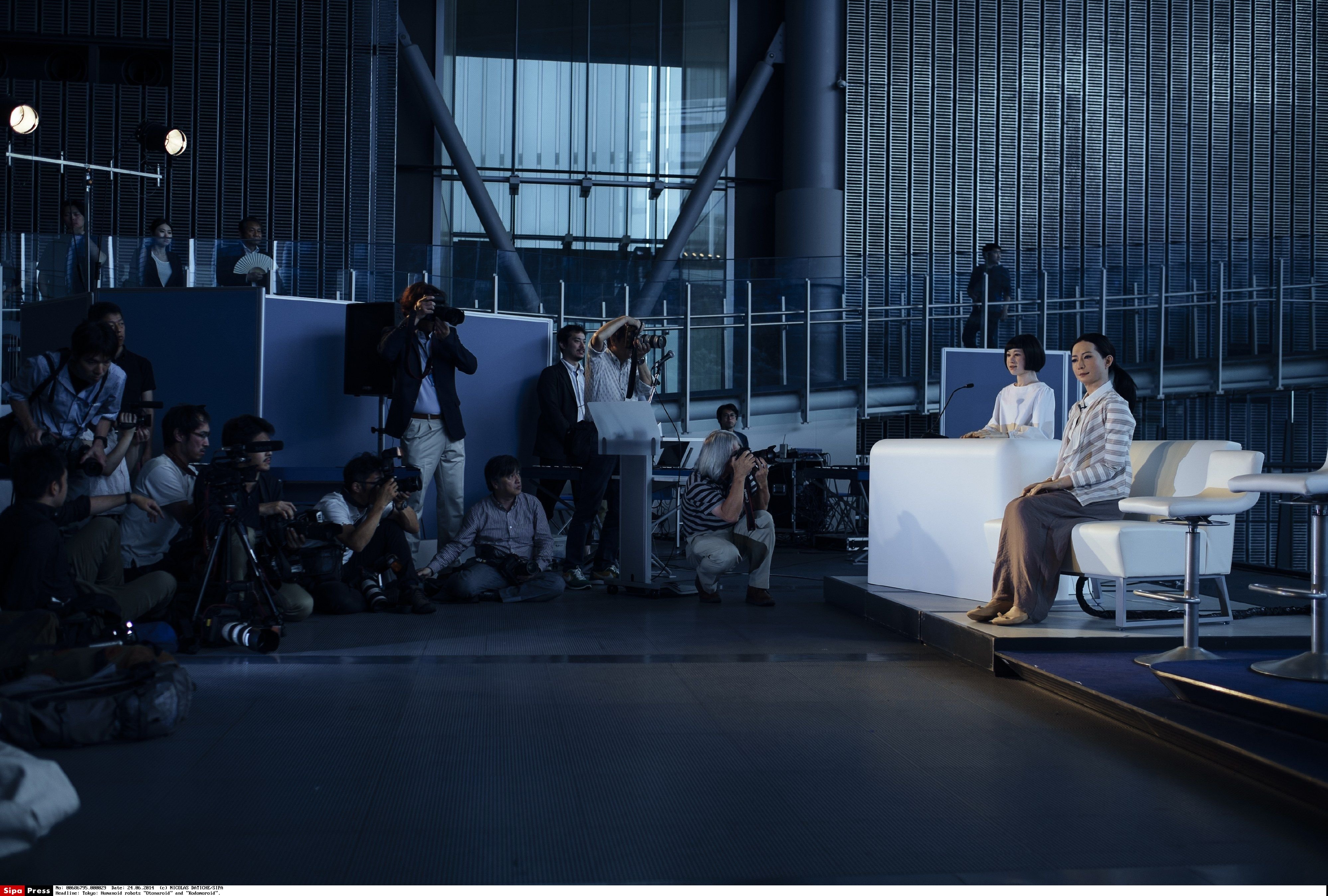 The new humanoid robots named "Otonaroid" and "Kodomoroid" are pictured during a press preview at the National Museum of Emerging Science and Technology in Tokyo on June 24, 2014.