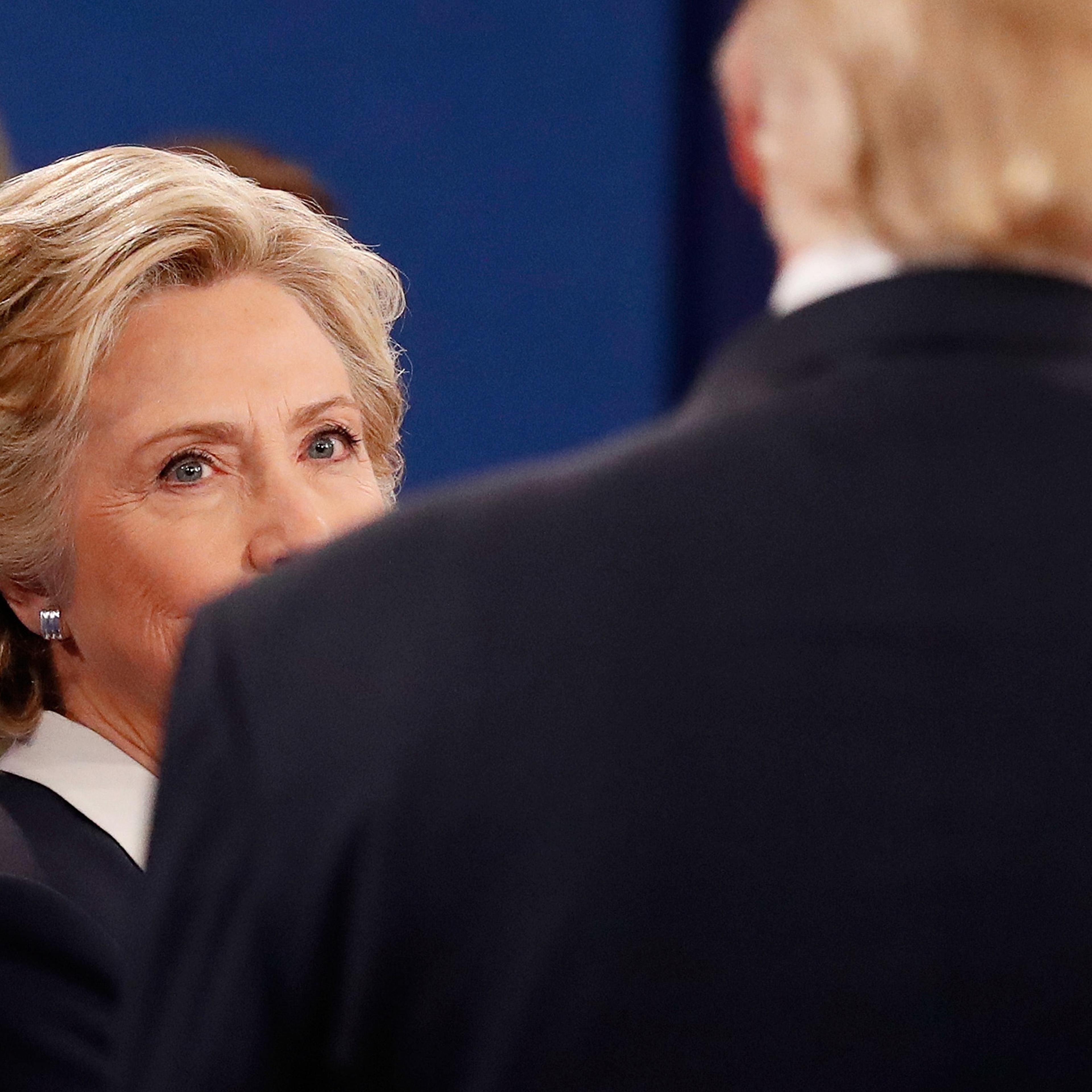 Hillary Clinton and Donald Trump attend the town hall debate at Washington University in St Louis, Missouri, on Oct. 9, 2016.