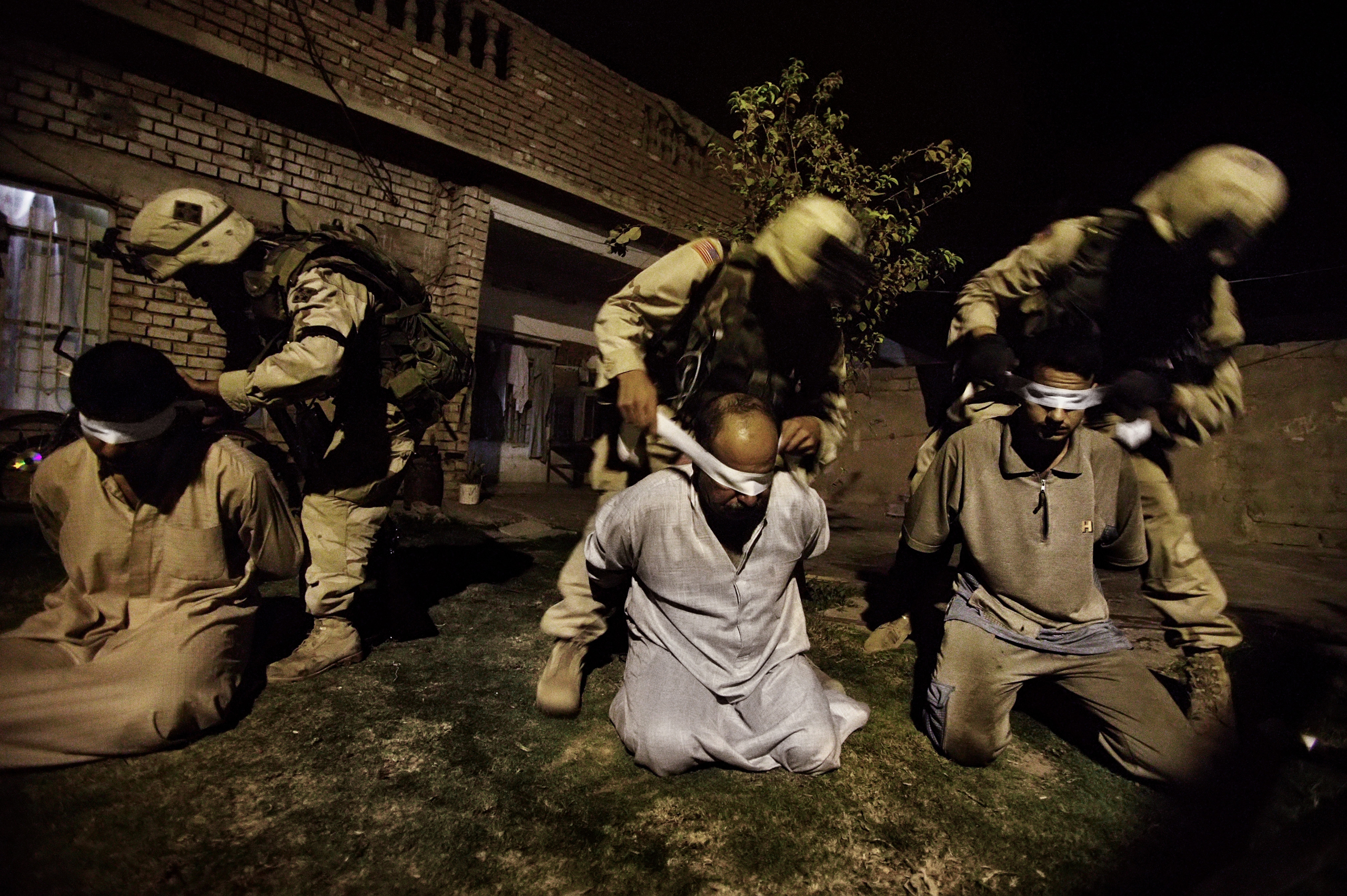 American soldiers of the 1st Battalion of the Fourth Division of the U.S. Army blindfold men suspected of being arms and explosive dealers in Tikrit, the birthplace of Saddam Hussein and stronghold of his Baathist party, Sept, 24, 2003. Baathists began c