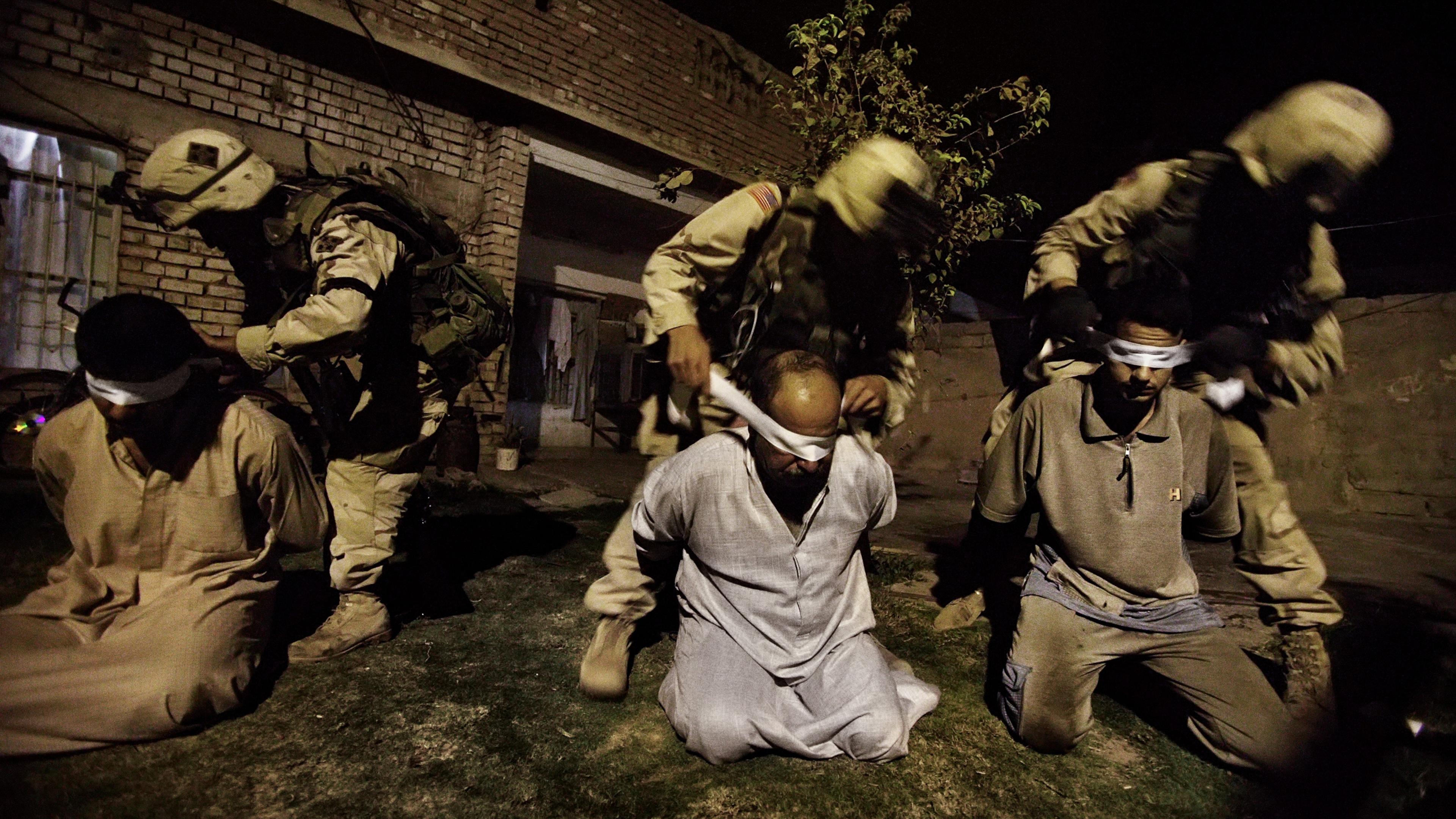 American soldiers of the 1st Battalion of the Fourth Division of the U.S. Army blindfold men suspected of being arms and explosive dealers in Tikrit, the birthplace of Saddam Hussein and stronghold of his Baathist party, Sept, 24, 2003. Baathists began c