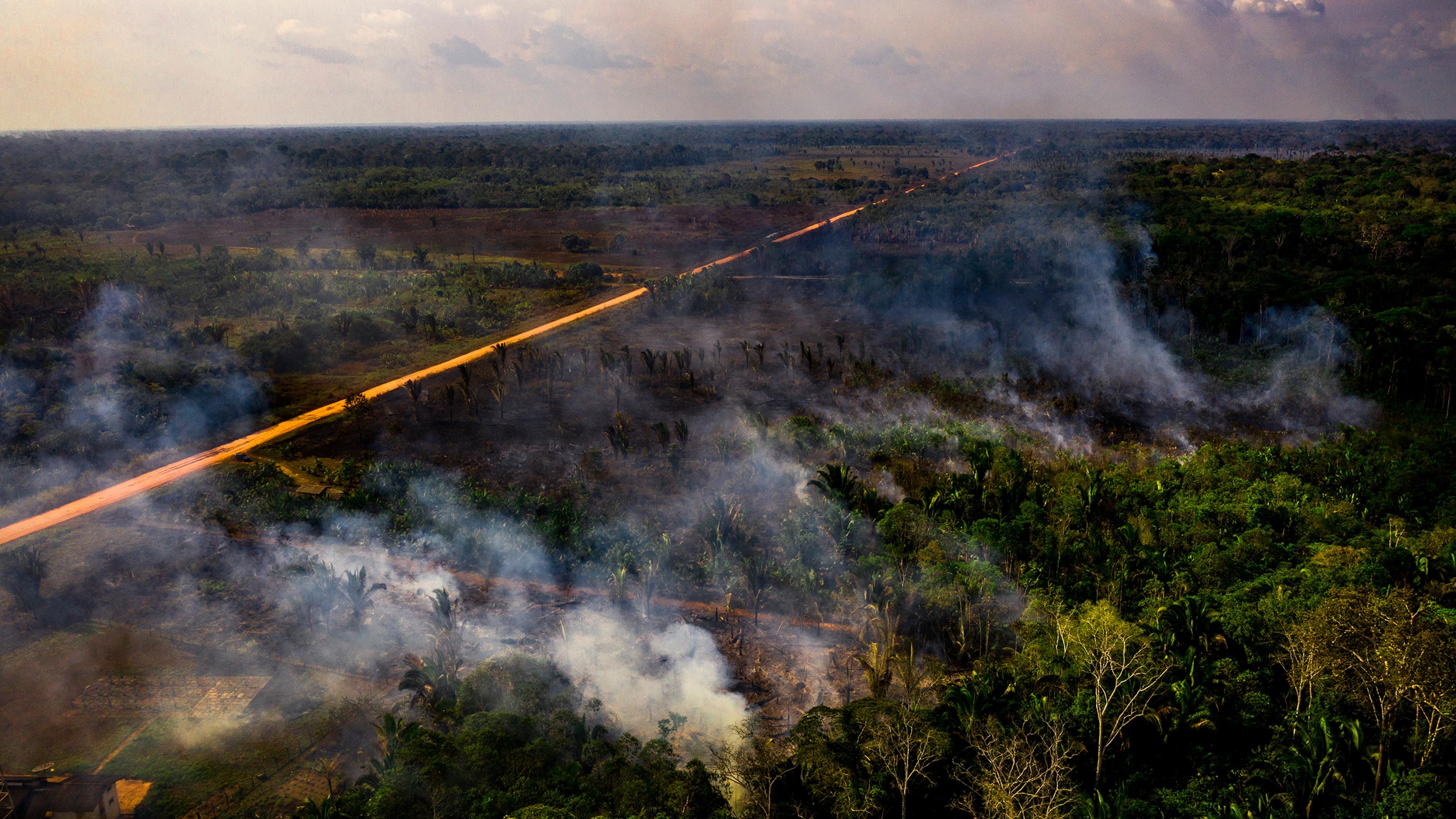 Smoke rises from fires in a section of the rain forest near Realidade, Brazil, on Aug. 26.