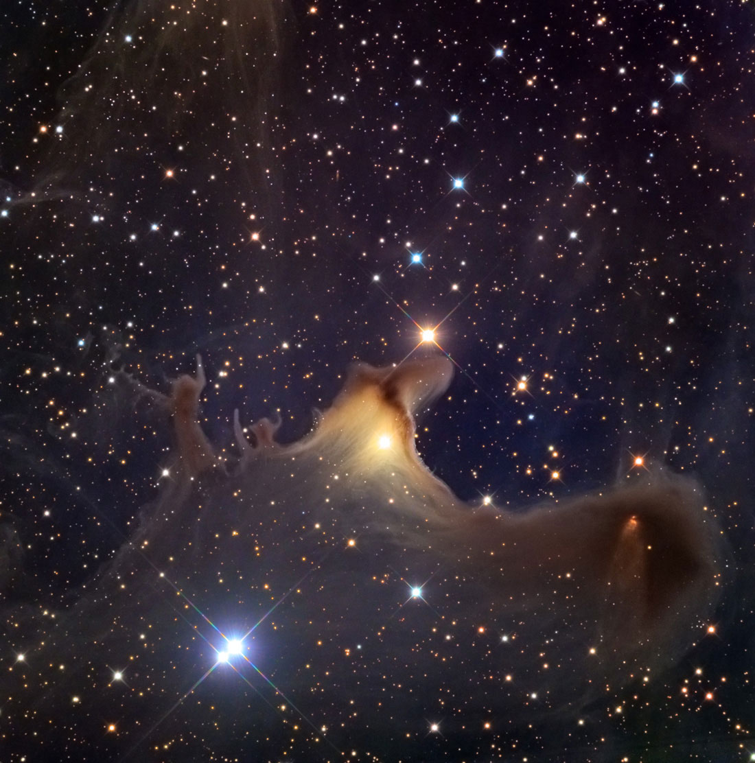 SH2-136 The Ghosts of CepheusThe Ghosts of Cepheus present a cosmic view with the chiaroscuro that the oldgreat painters might have applied to their canvases. Here a few bright starsilluminate an otherwise dark and cold molecular cloud of gas and dust so