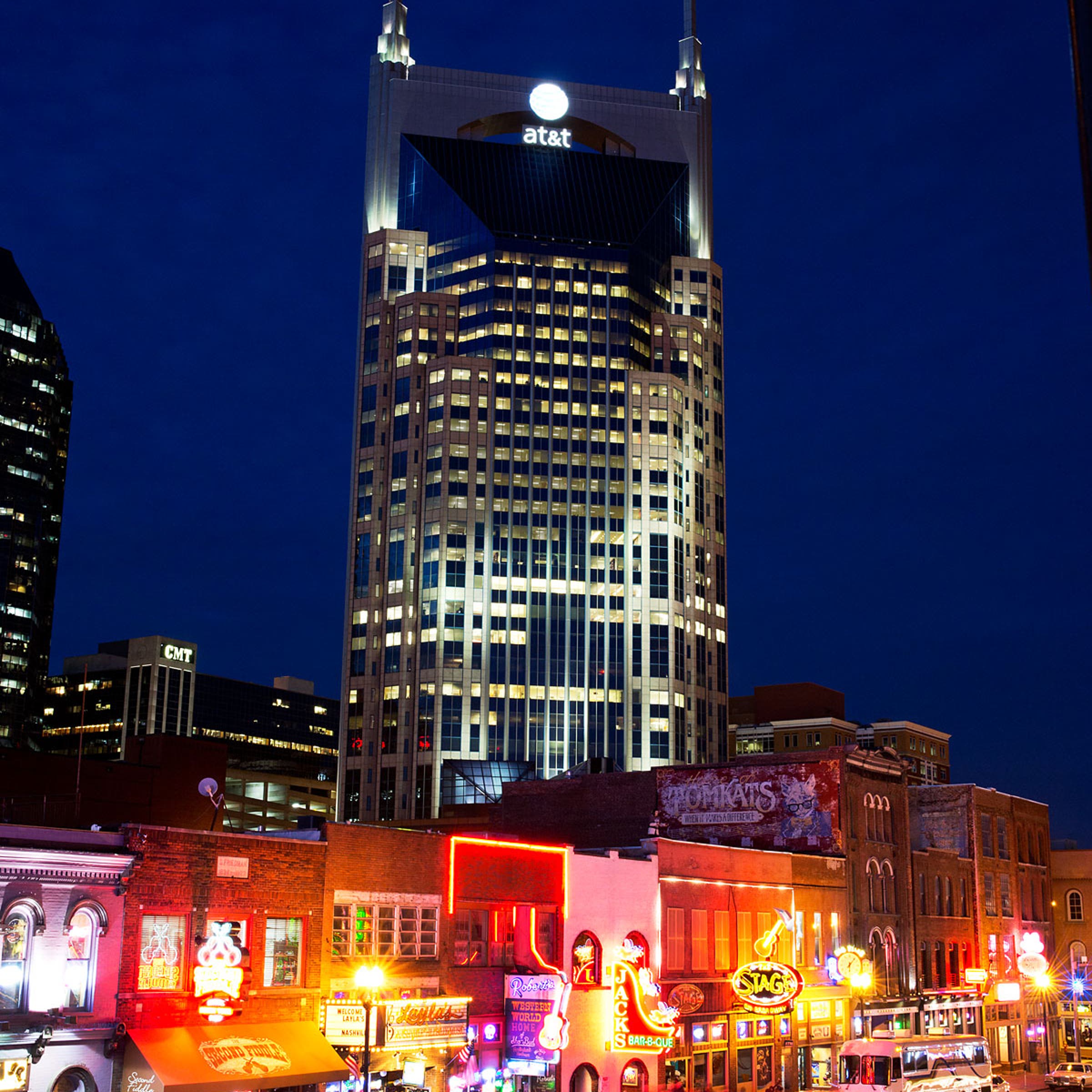 Lower Broadway is seen at night with the AT&T building or "the Batman building" and CMT in the background in Nashville, February 25, 2014.