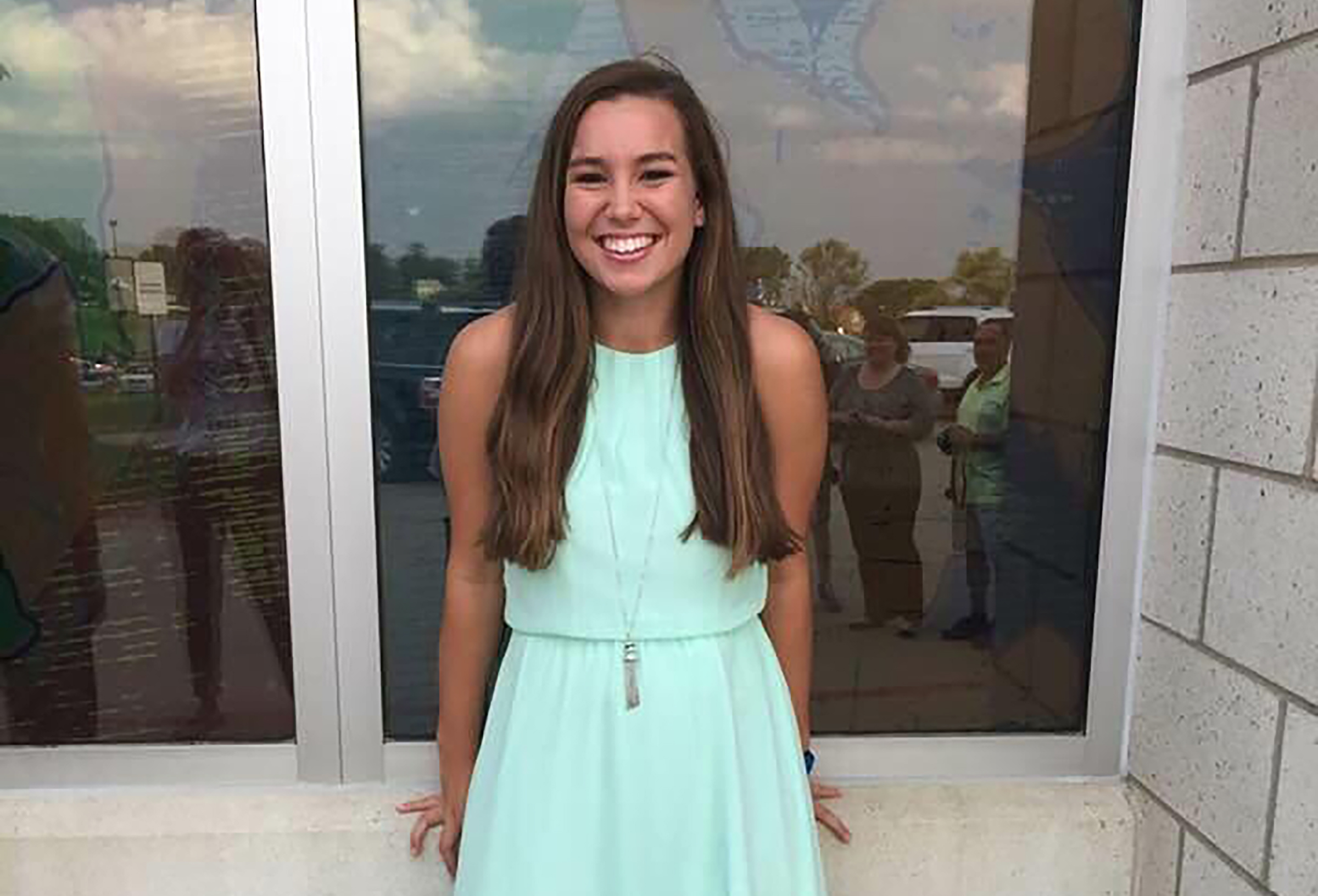 Mollie Tibbetts smiling in a blue dress