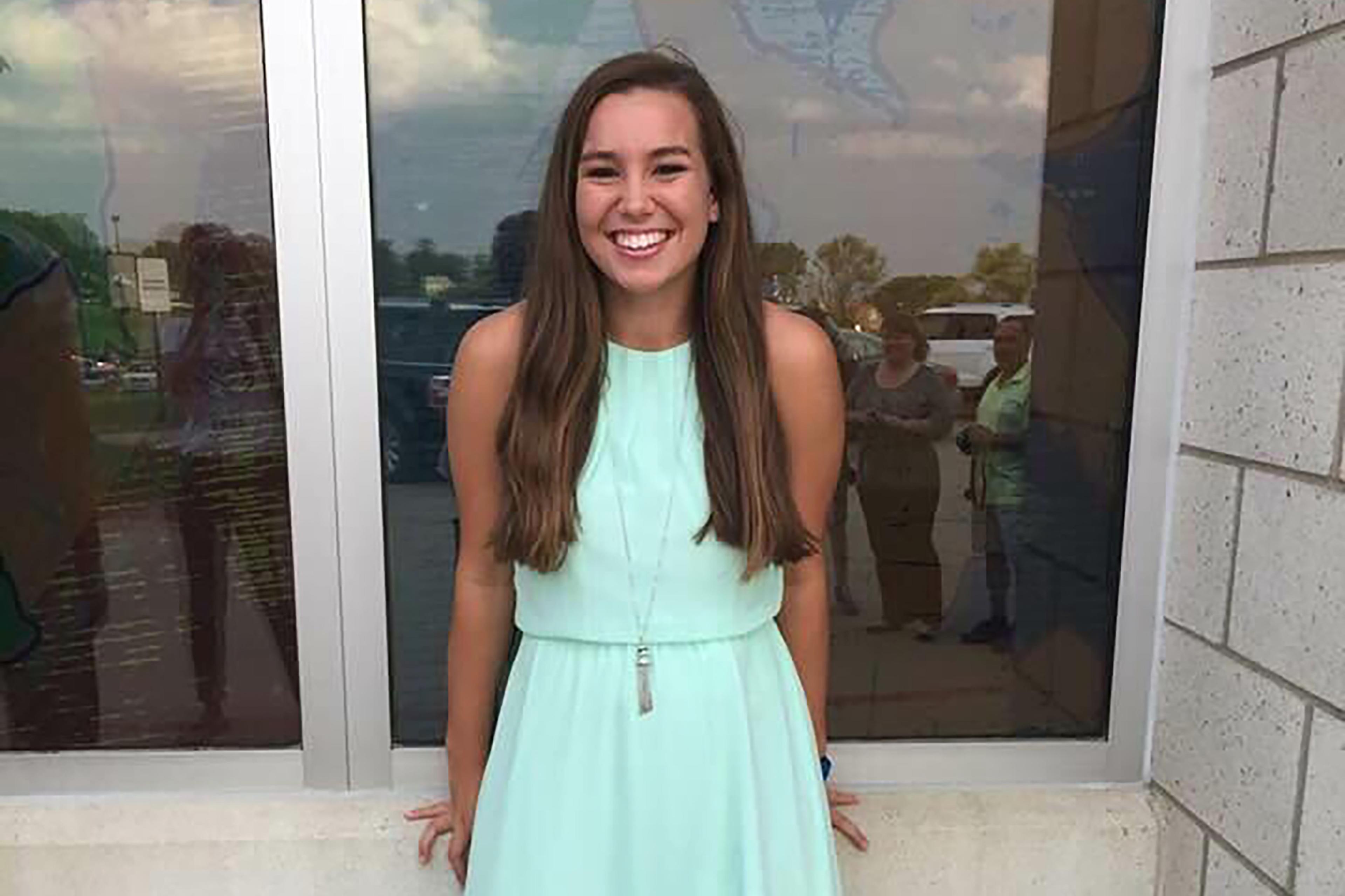 Mollie Tibbetts smiling in a blue dress