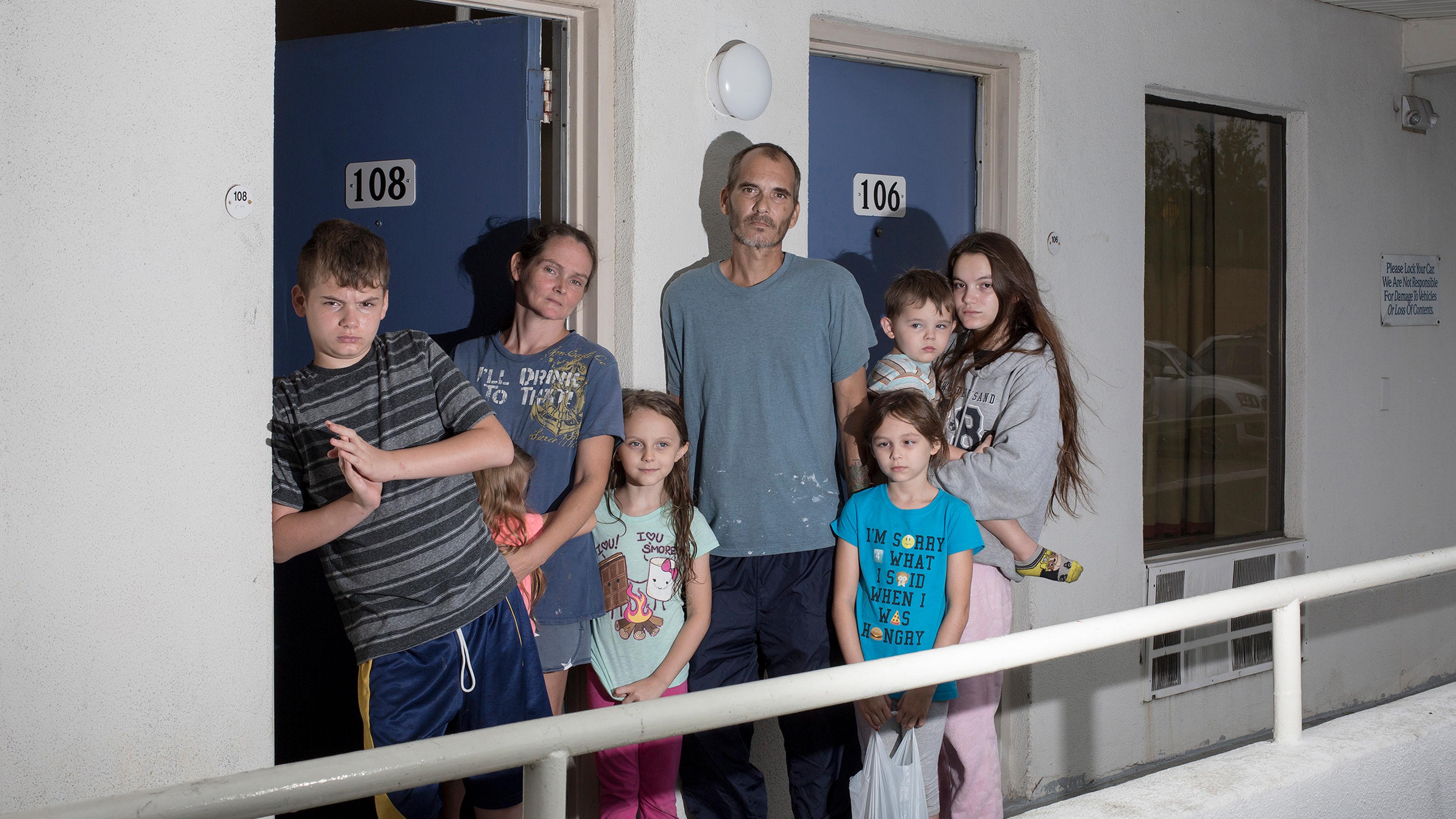 The Brown family from Jacksonville, N.C., poses for a portrait at a motel after fleeing Hurricane Florence in Cary, N.C. on Sept. 14, 2018.
