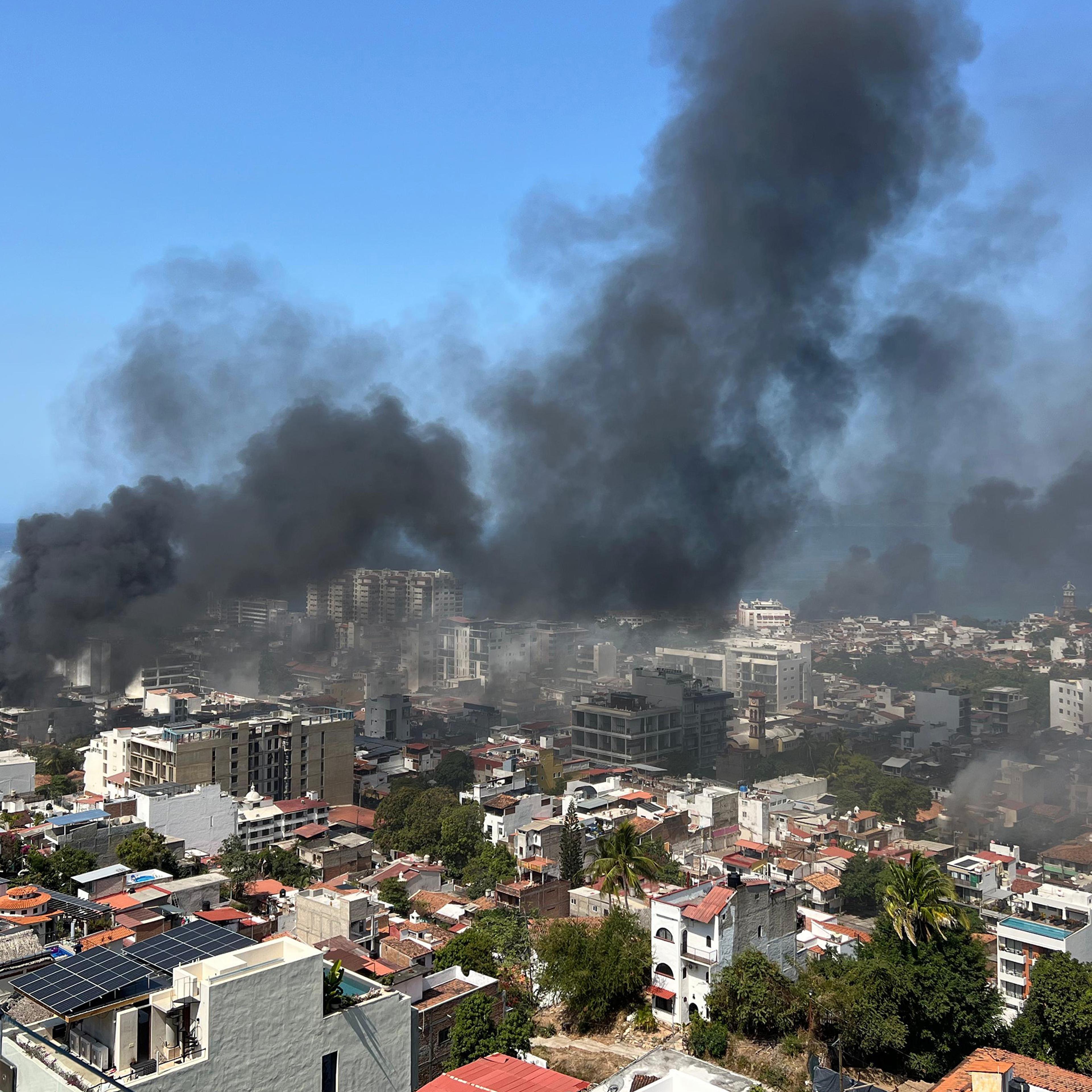 Smoke above a city skyline.