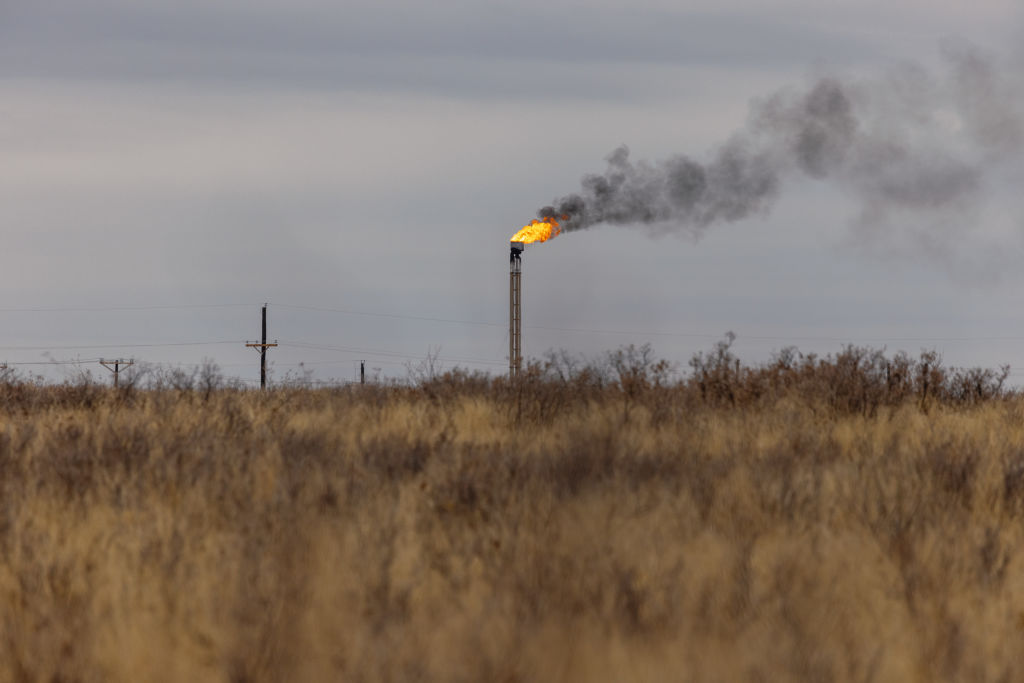 A natural gas flare stack at an oil well in Midland, Texas, U.S. on April 4, 2022.