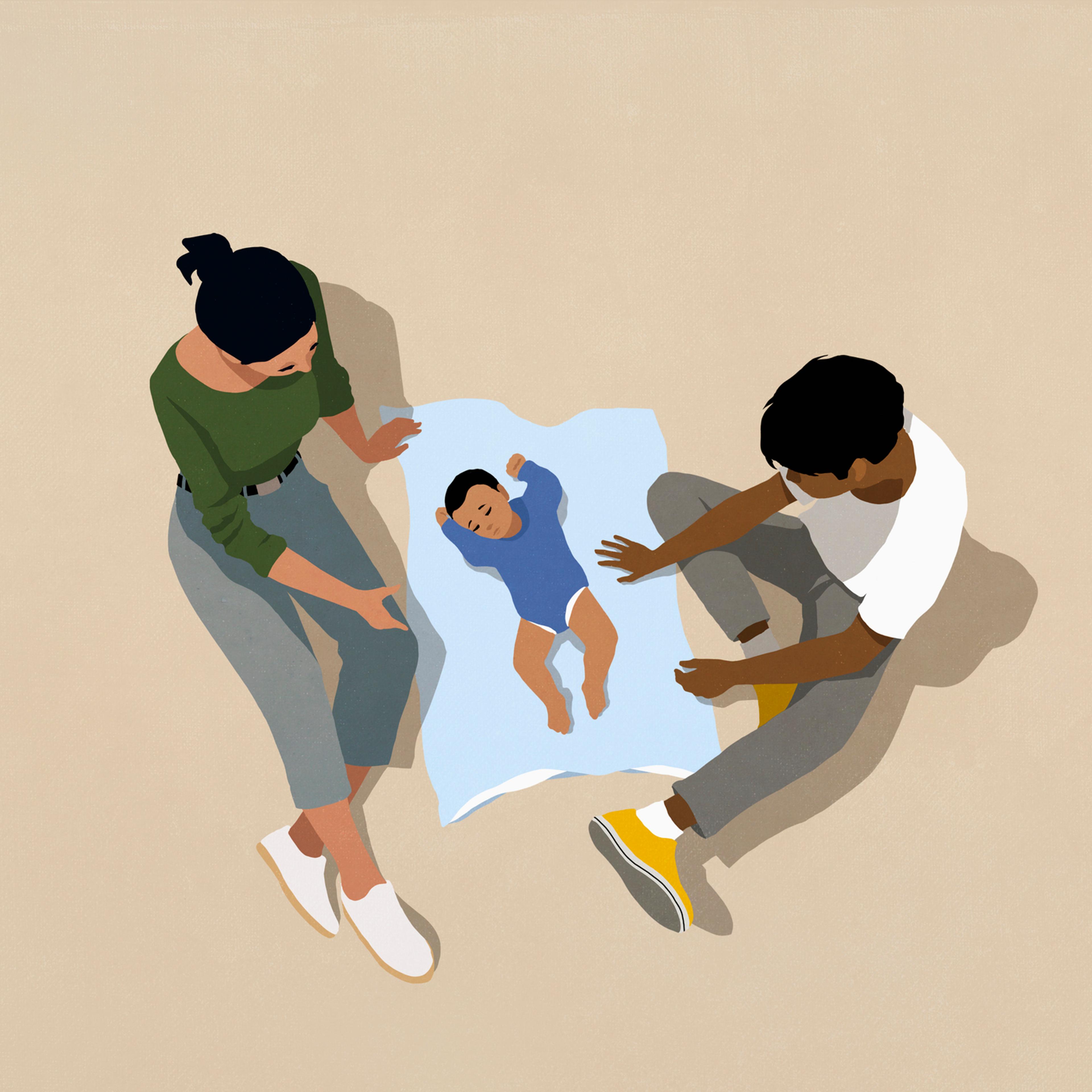 Parents watching baby son sleeping on blanket against beige background