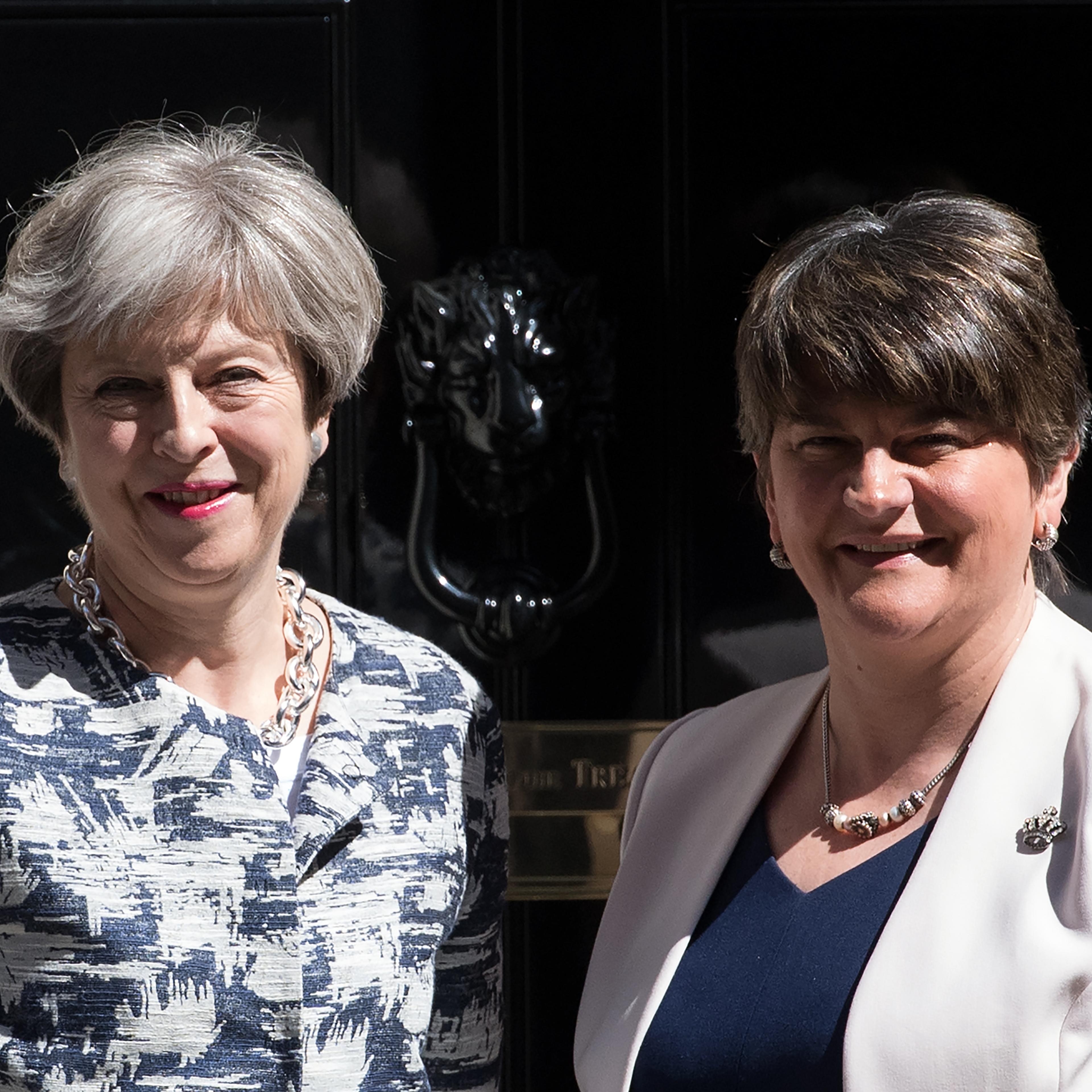 Britain's Prime Minister, Theresa May (L), greets Arlene Foster, the leader of Northern Ireland's Democratic Unionist Party in Downing Street on June 26, 2017 in London, England.