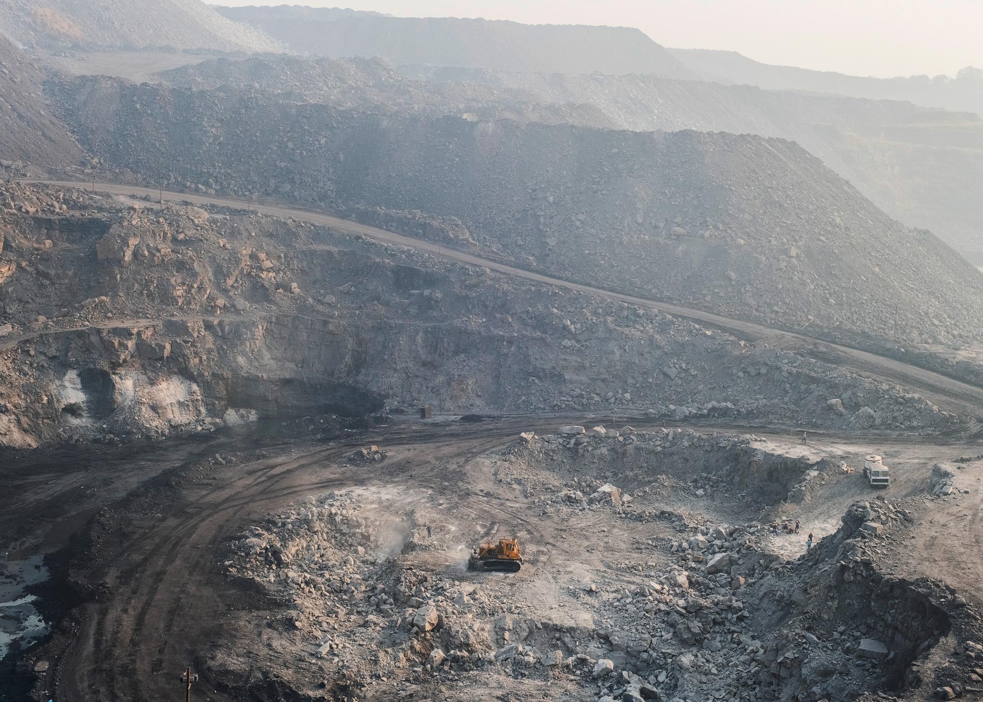 Jharia coalfield in Dhanbad, in the state of Jharkhand. Mountaintop removal is a form of surface mining where the tops of mountains are dynamited and removed to access coal seams.