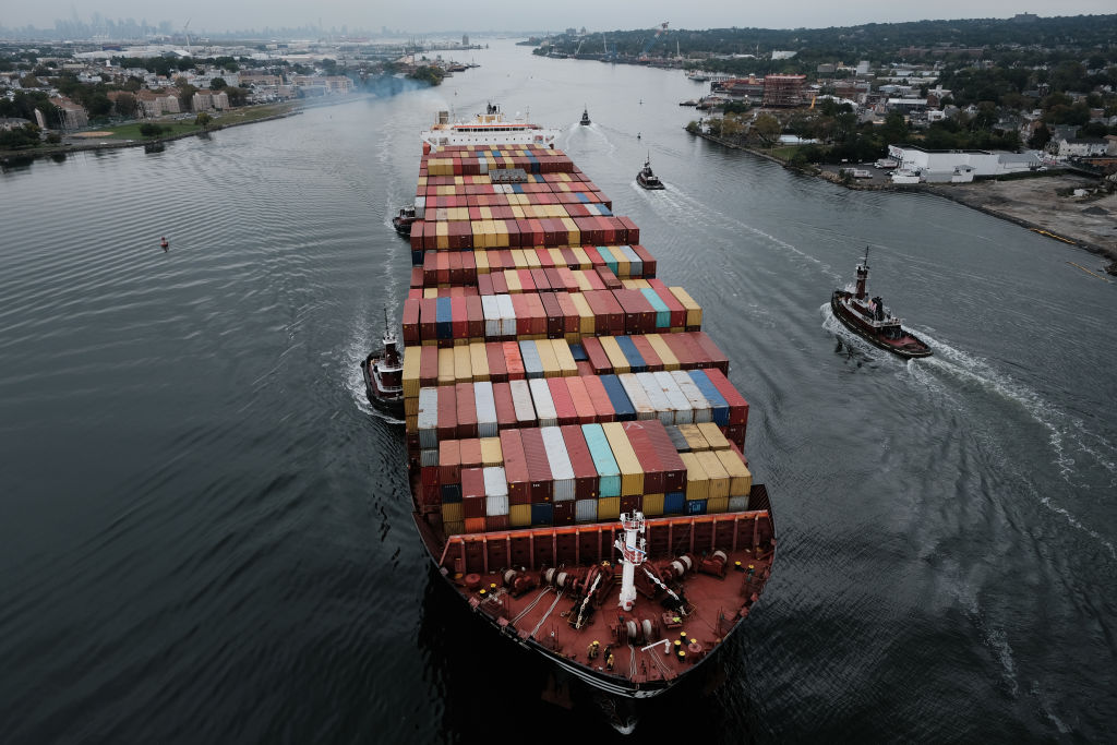 A cargo ship moves under the Bayonne Bridge as it heads into port on October 13, 2021 in Bayonne, New Jersey.