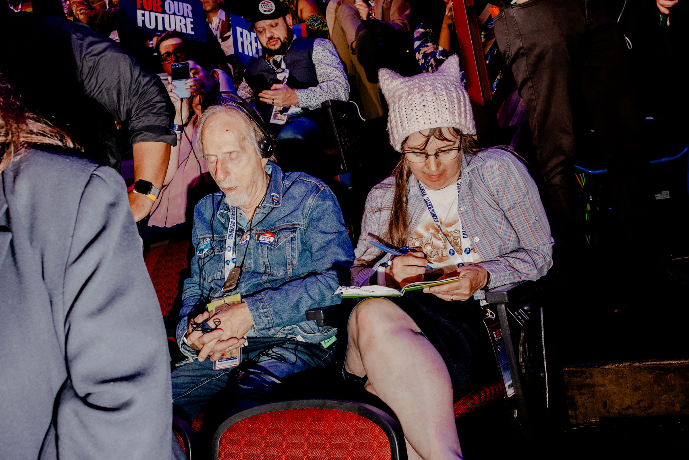 Day 2: Attendees sit in the crowd, Aug. 20