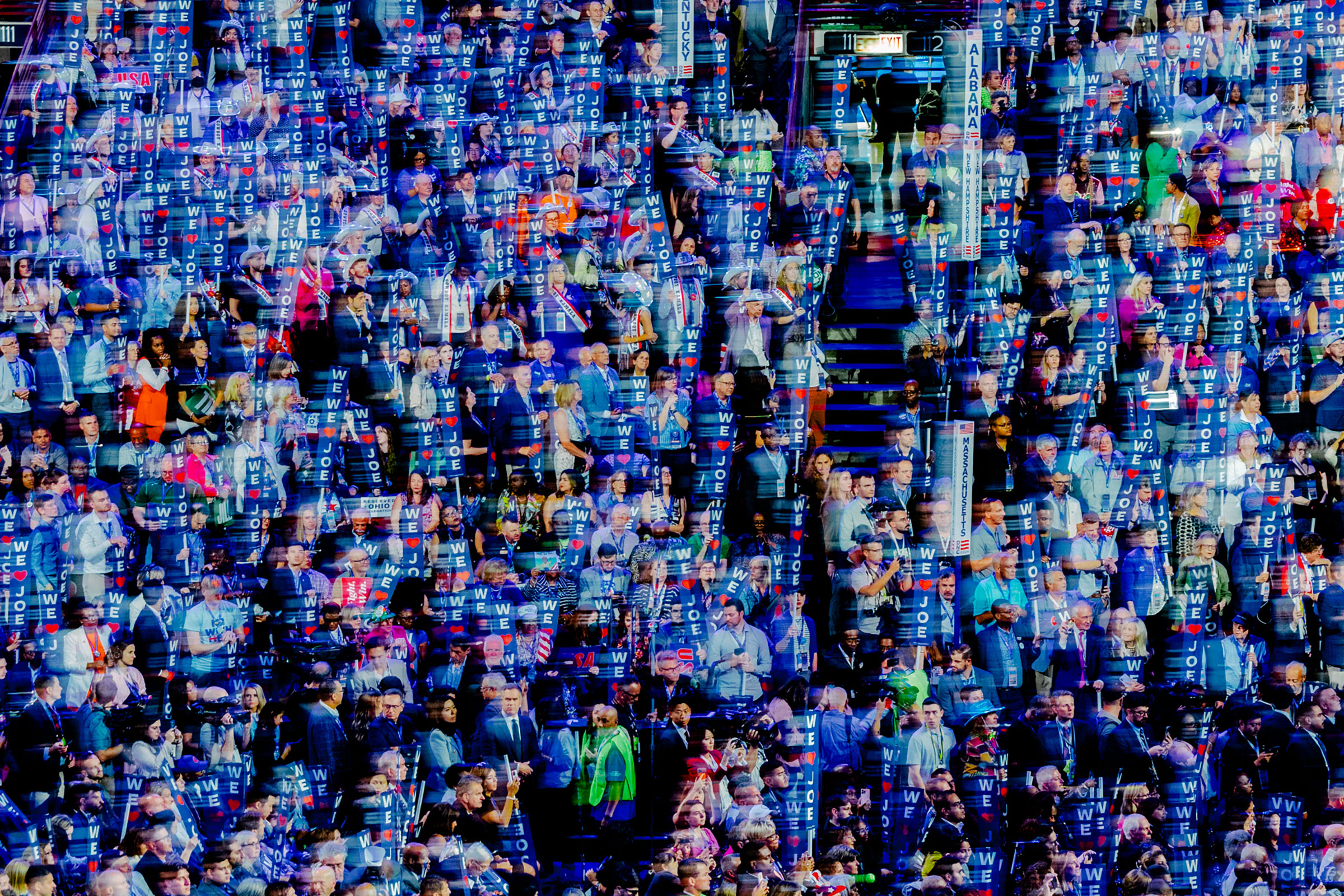 Day 1: Attendees in the crowd hold 'We Love Joe' signs, Aug. 19