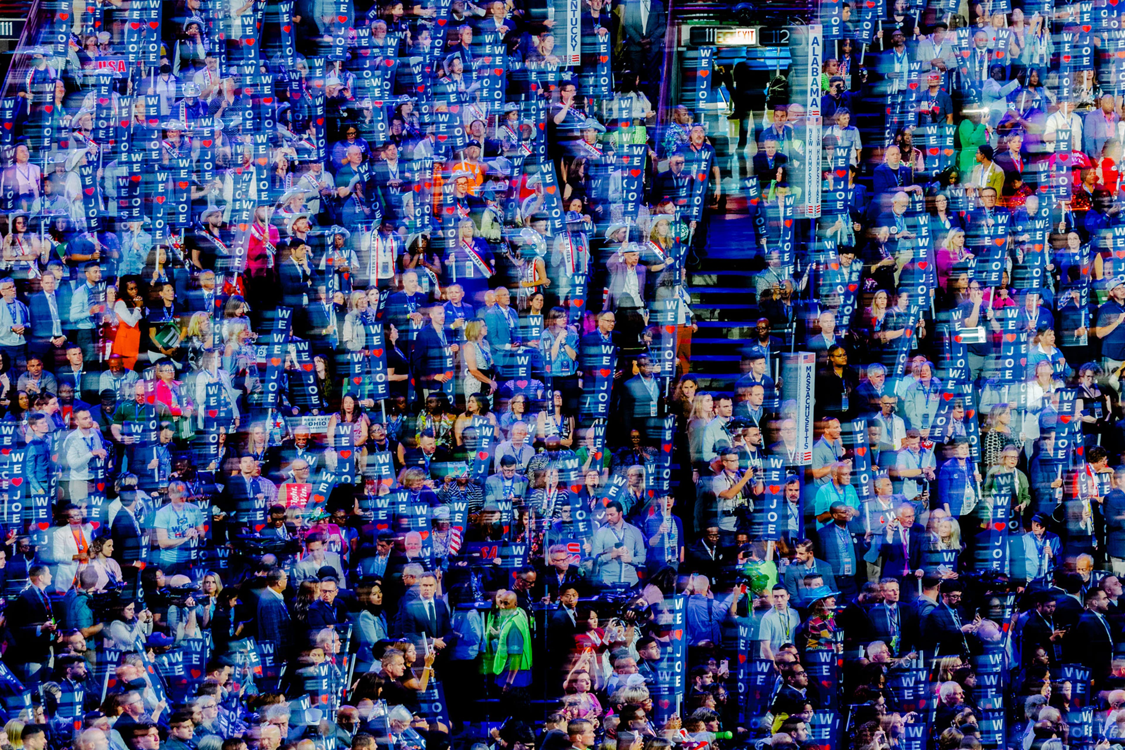 Day 1: Attendees in the crowd hold 'We Love Joe' signs, Aug. 19