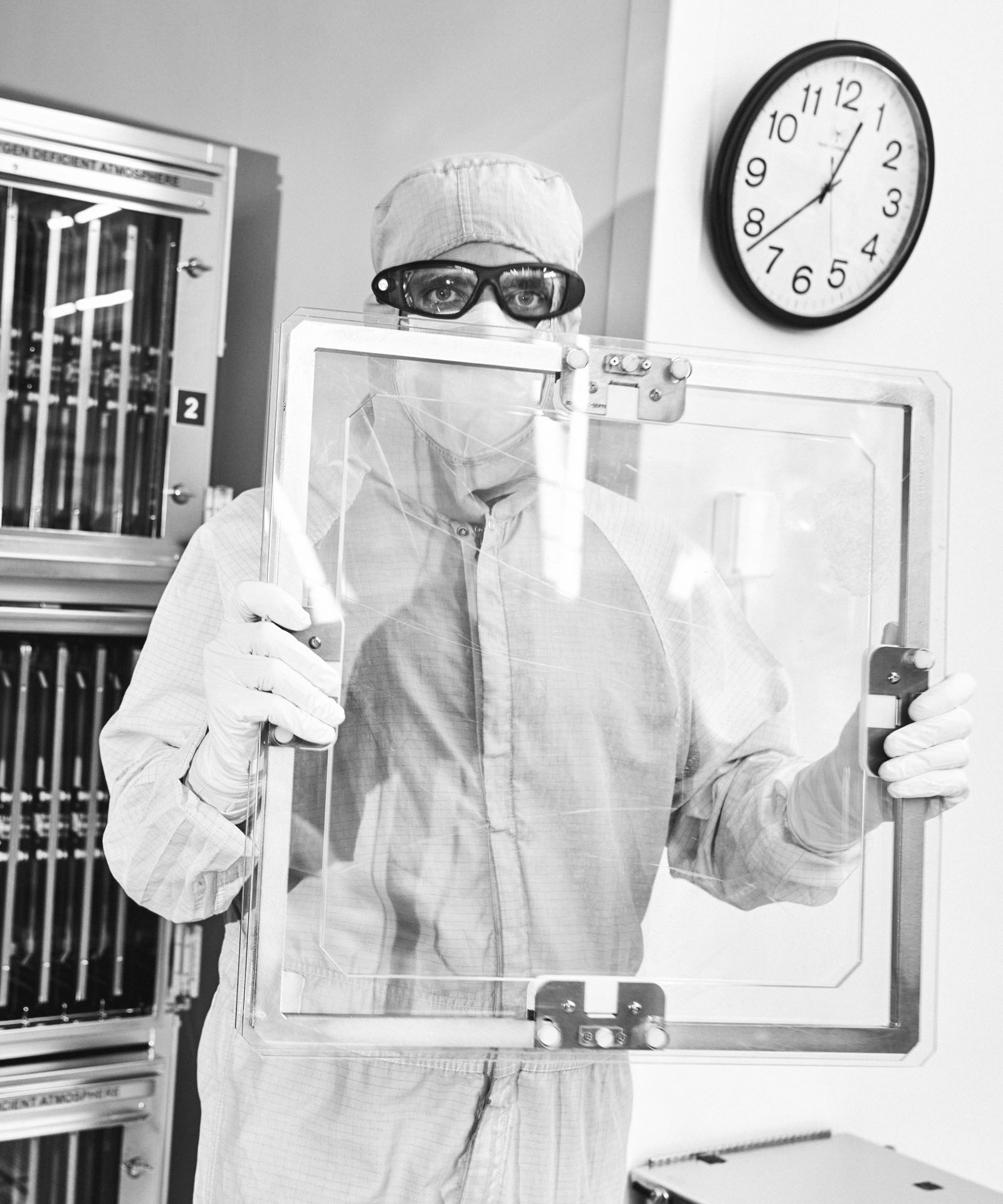 An Optics Processing technician prepares a Grating Debris Shield  for inspection in the Optical Processing Facility at Lawrence Livermore National Laboratory in Livermore, California, United States on December 8, 2023.