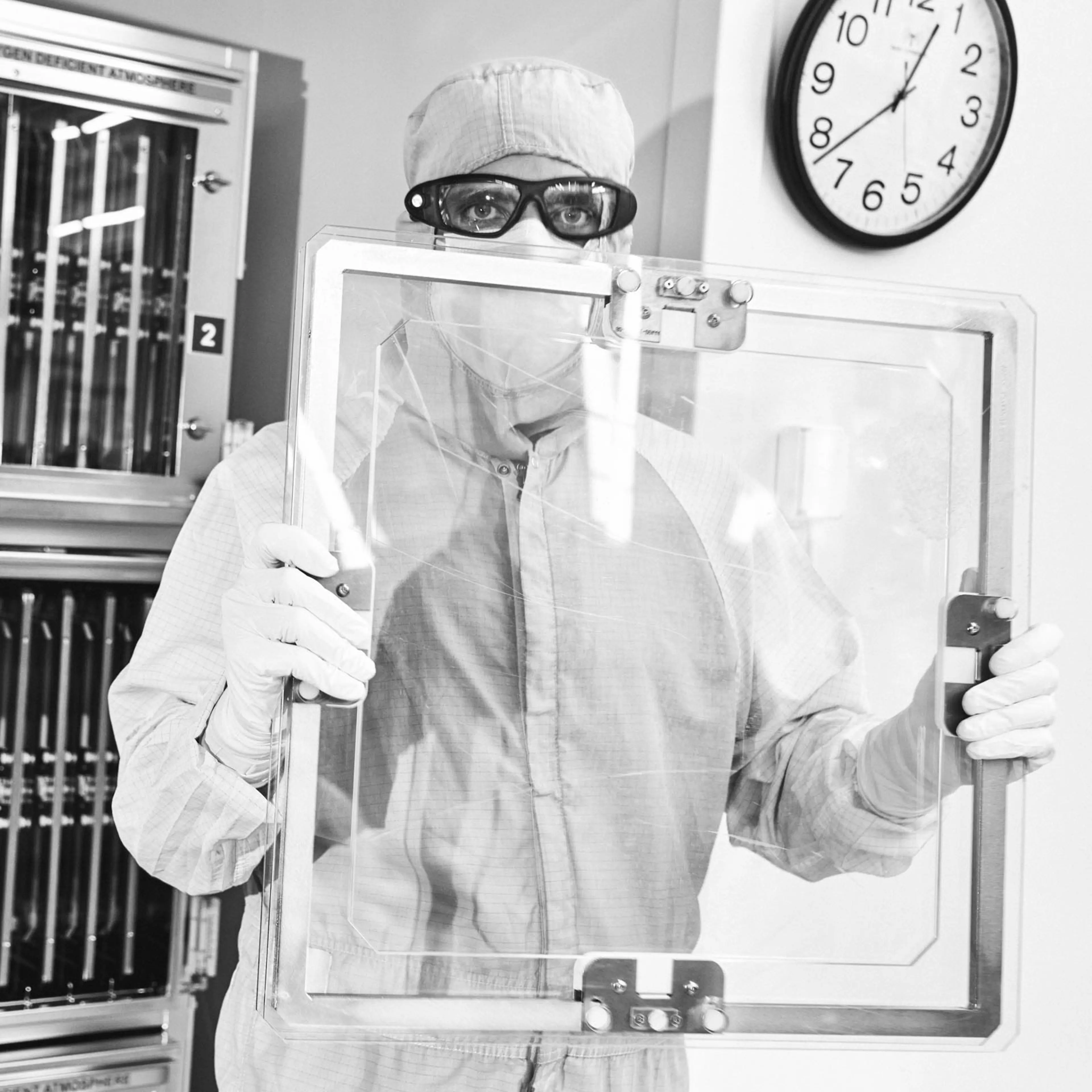 An Optics Processing technician prepares a Grating Debris Shield for inspection in the Optical Processing Facility at Lawrence Livermore National Laboratory in Livermore, California, United States on December 8, 2023.