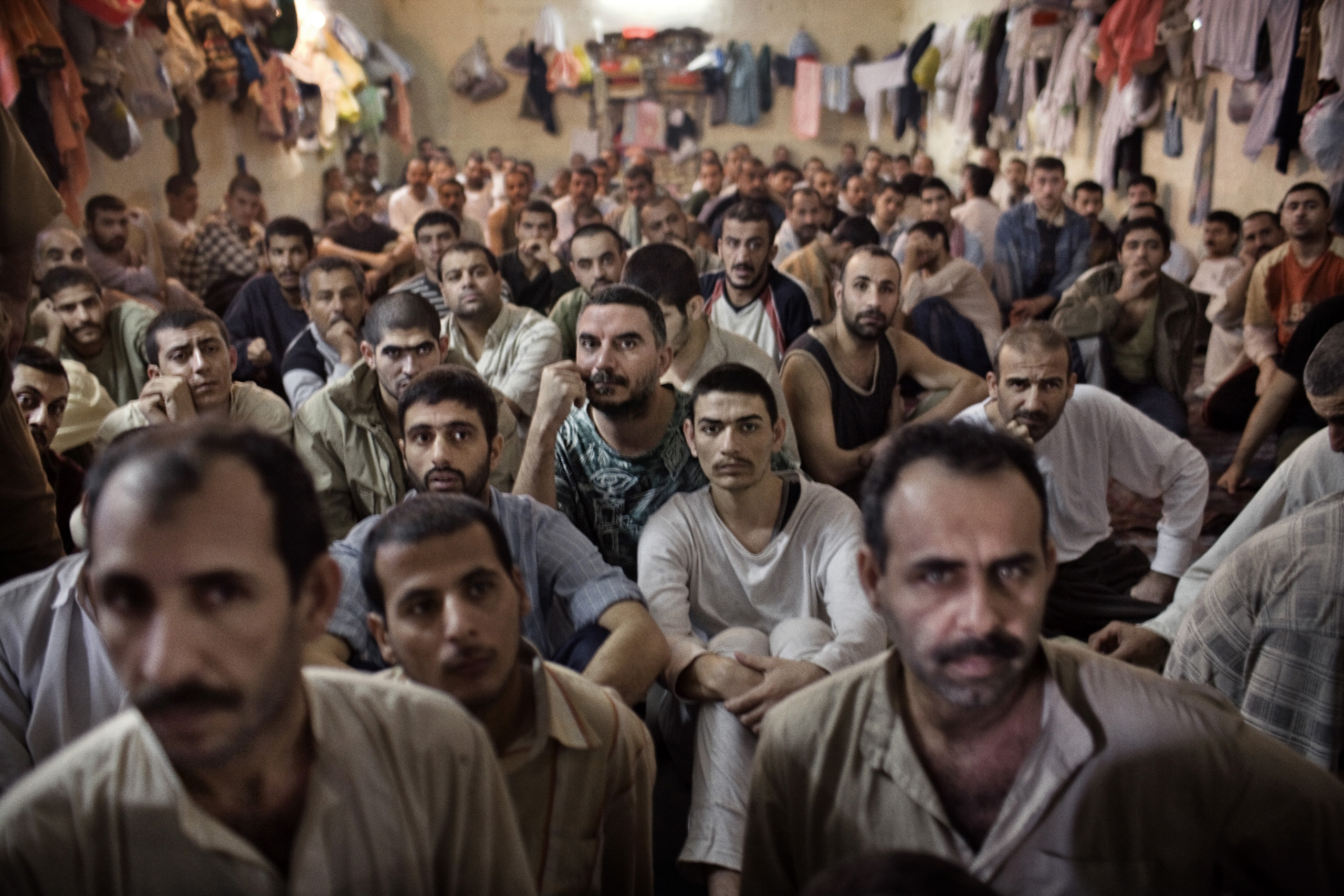 Iraqi prisoners are held in an overcrowded Interior Ministry prison, detained by the feared Iraqi police commandos, Wolf Brigade, an almost exclusively Shi'ite counter-insurgency unit, Baghdad, Iraq, Nov. 30, 2005.