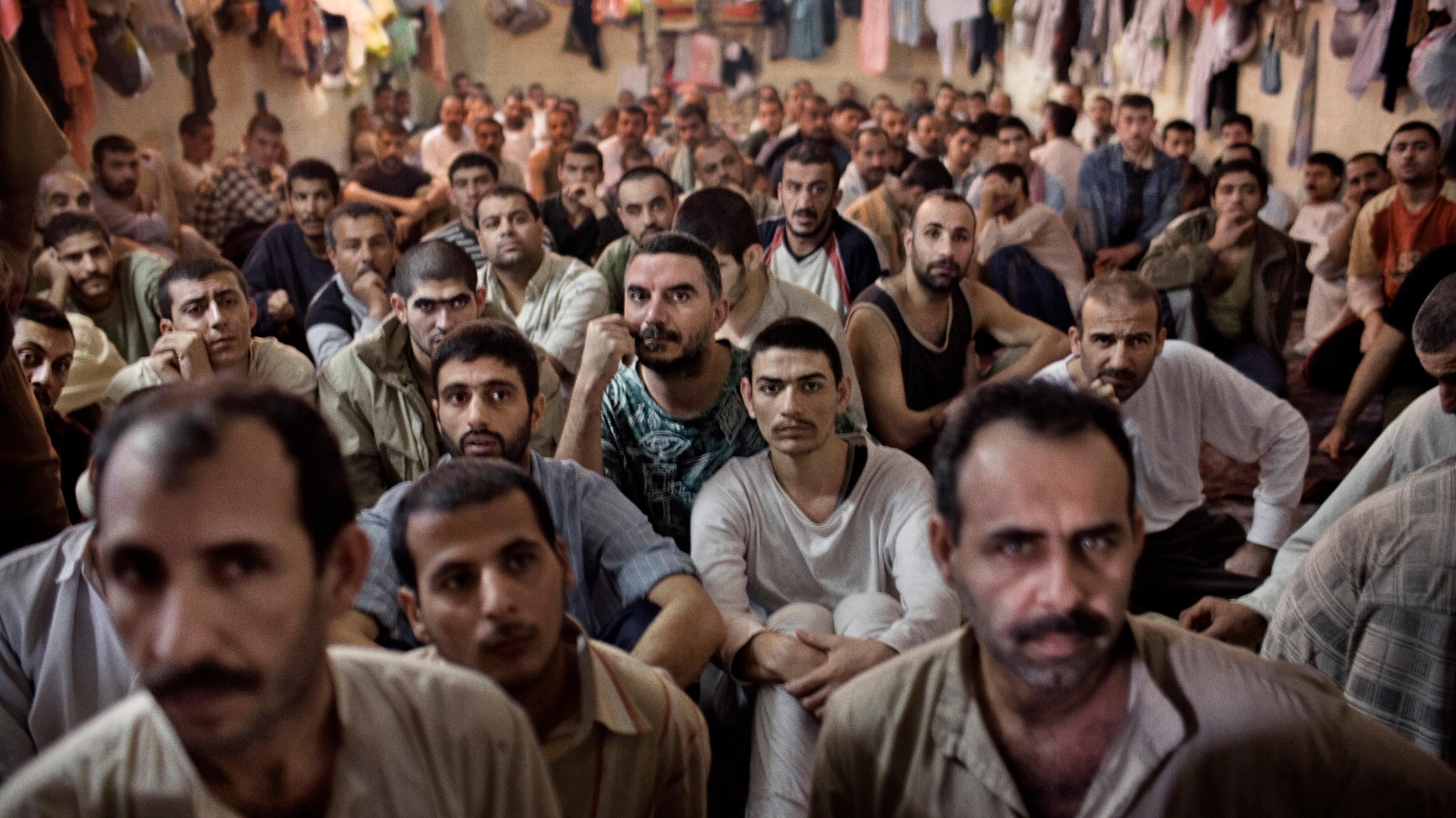 Iraqi prisoners are held in an overcrowded Interior Ministry prison, detained by the feared Iraqi police commandos, Wolf Brigade, an almost exclusively Shi'ite counter-insurgency unit, Baghdad, Iraq, Nov. 30, 2005.