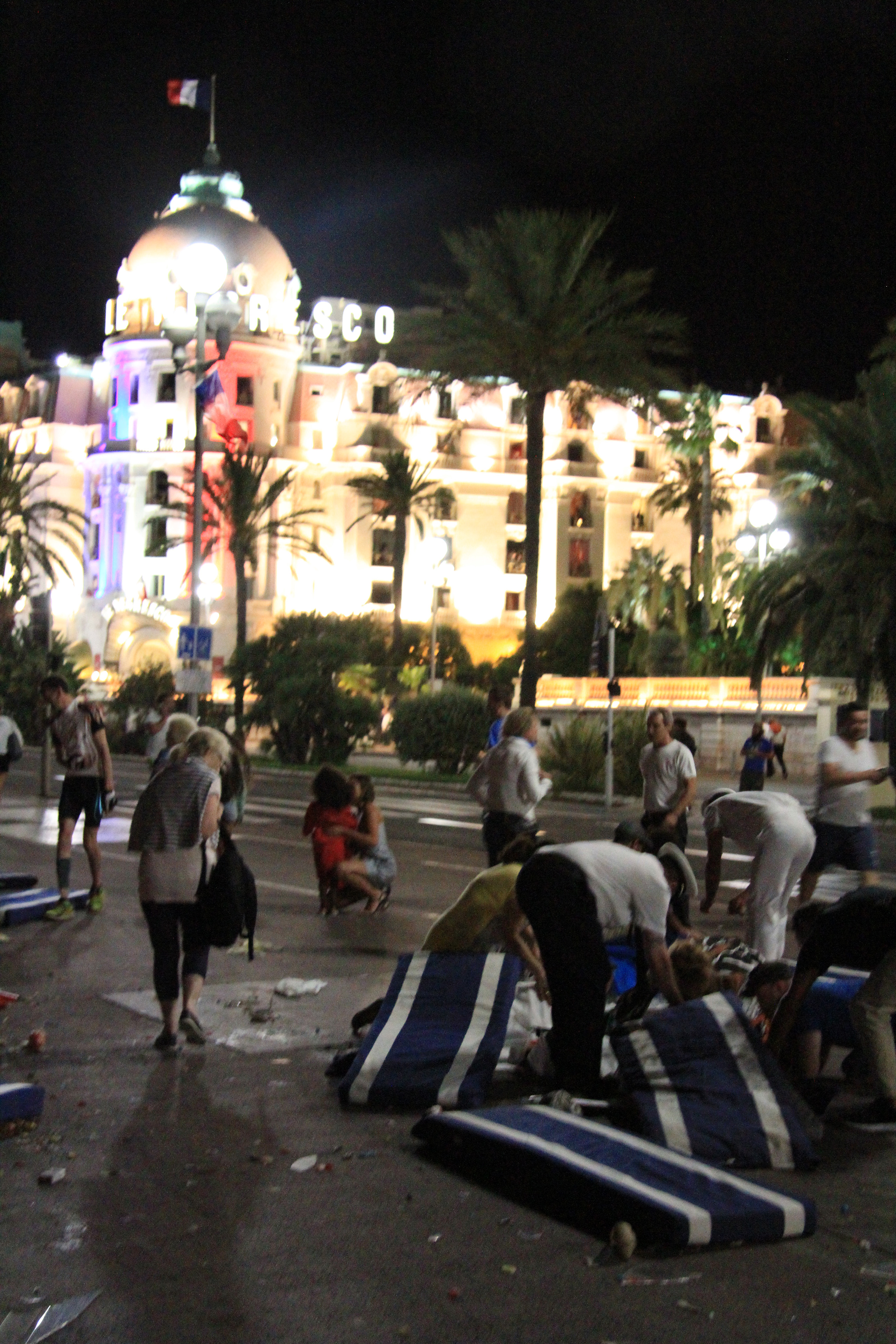 First responders in Nice, France, after authorities said at least 77 people were killed and many more injured after a truck slammed into a crowd on July 14, 2016.