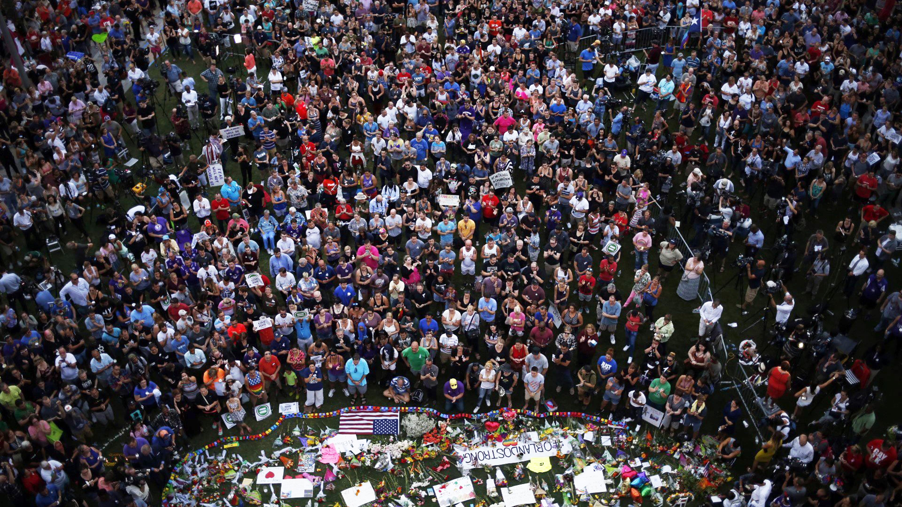 Hundreds of people gather at a memorial outside of the Dr. Phillips Center for the Performing Arts in Orlando, Fla., on June 13, 2016.