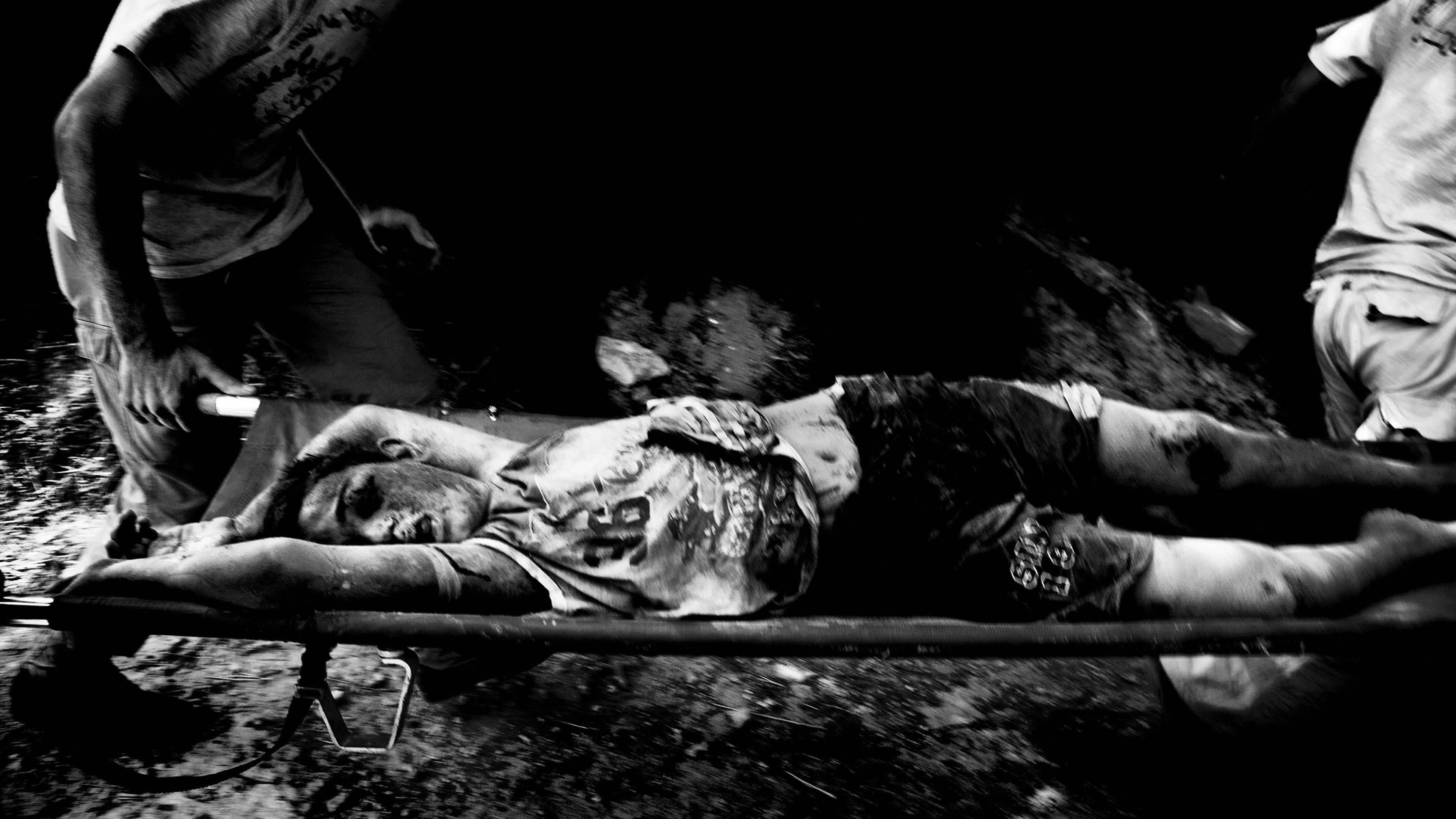 There's no oneIn the villageNot a humanNor a stoneThere's no oneIn the villageChildren are goneAnd a mother rocksherself to sleepLet it come downLet her weepThe dead lay in strange shapesSome stay buriedOthers crawl freeBaby didn't make itScreaming debri