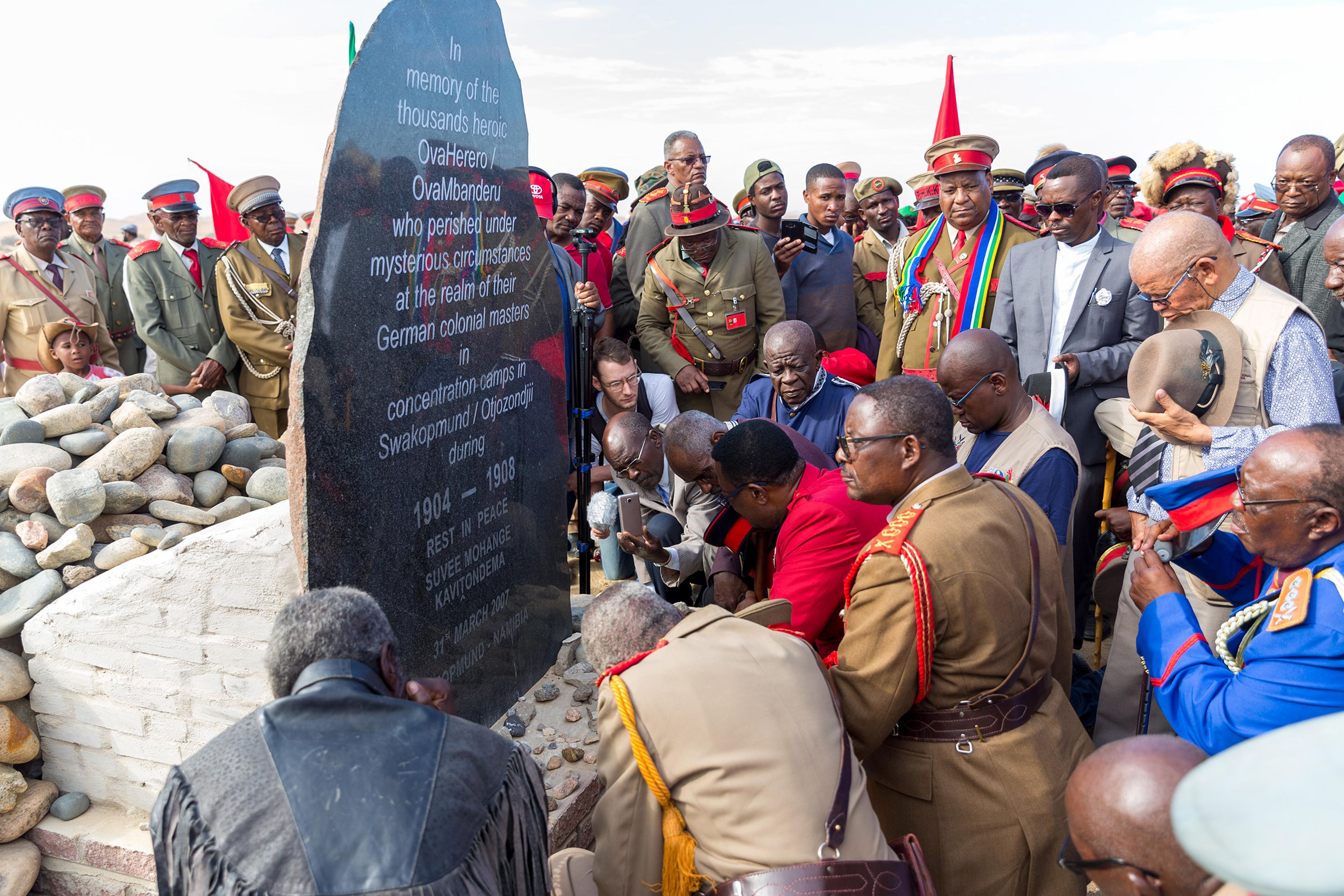 Paramount Chief Adv. Vekuii Rukoro, high-ranked chiefs and other members of the Herero and Nama communities gather around a monument in honor of the Ovaherero and Nama people that were victims of the genocide by German colonial forces at the Swakopmund C