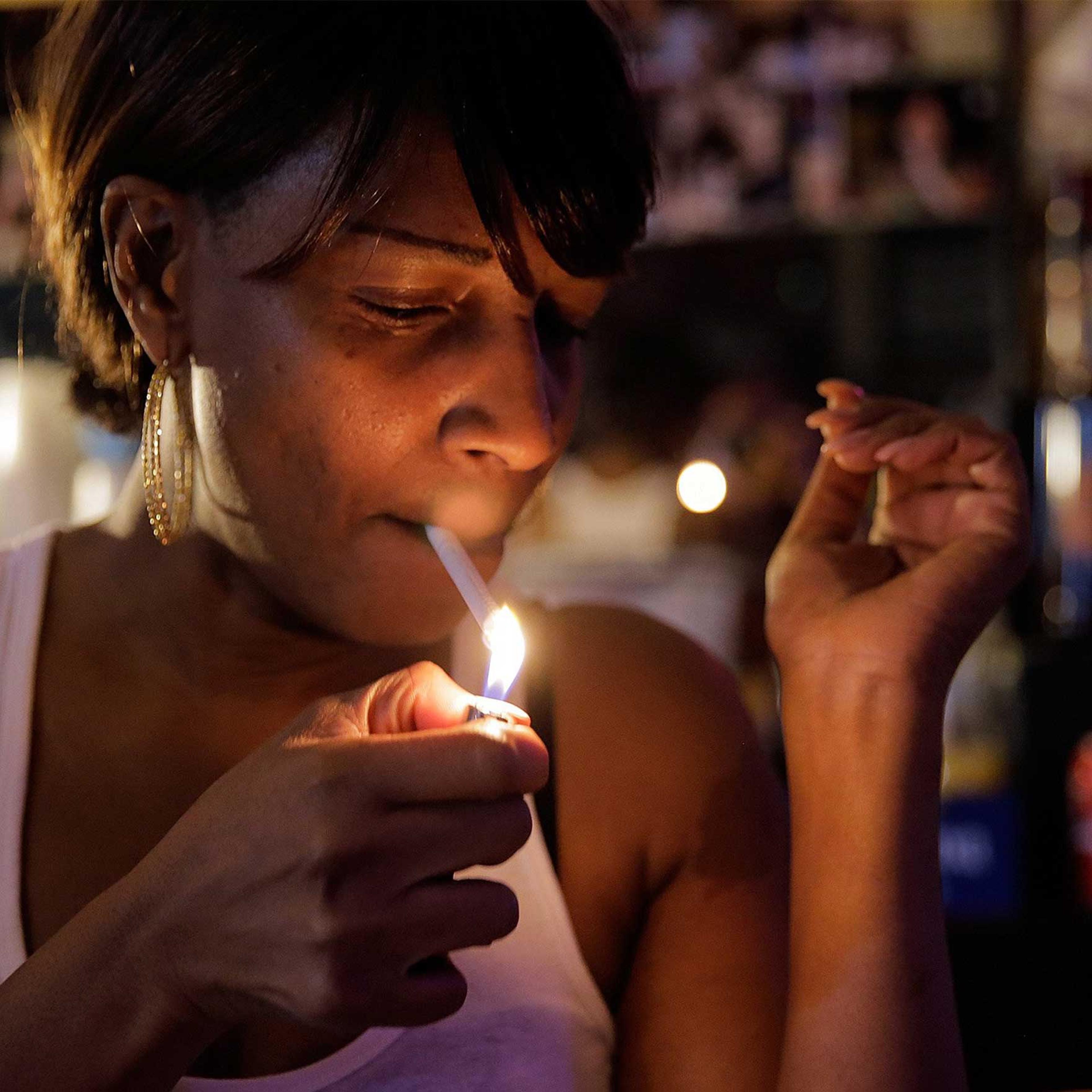 Judy Hill, owner of the Ooh Poo Pah Doo Bar in New Orleans, enjoys a smoke just days before the new city smoking ordinance on April 17, 2015.