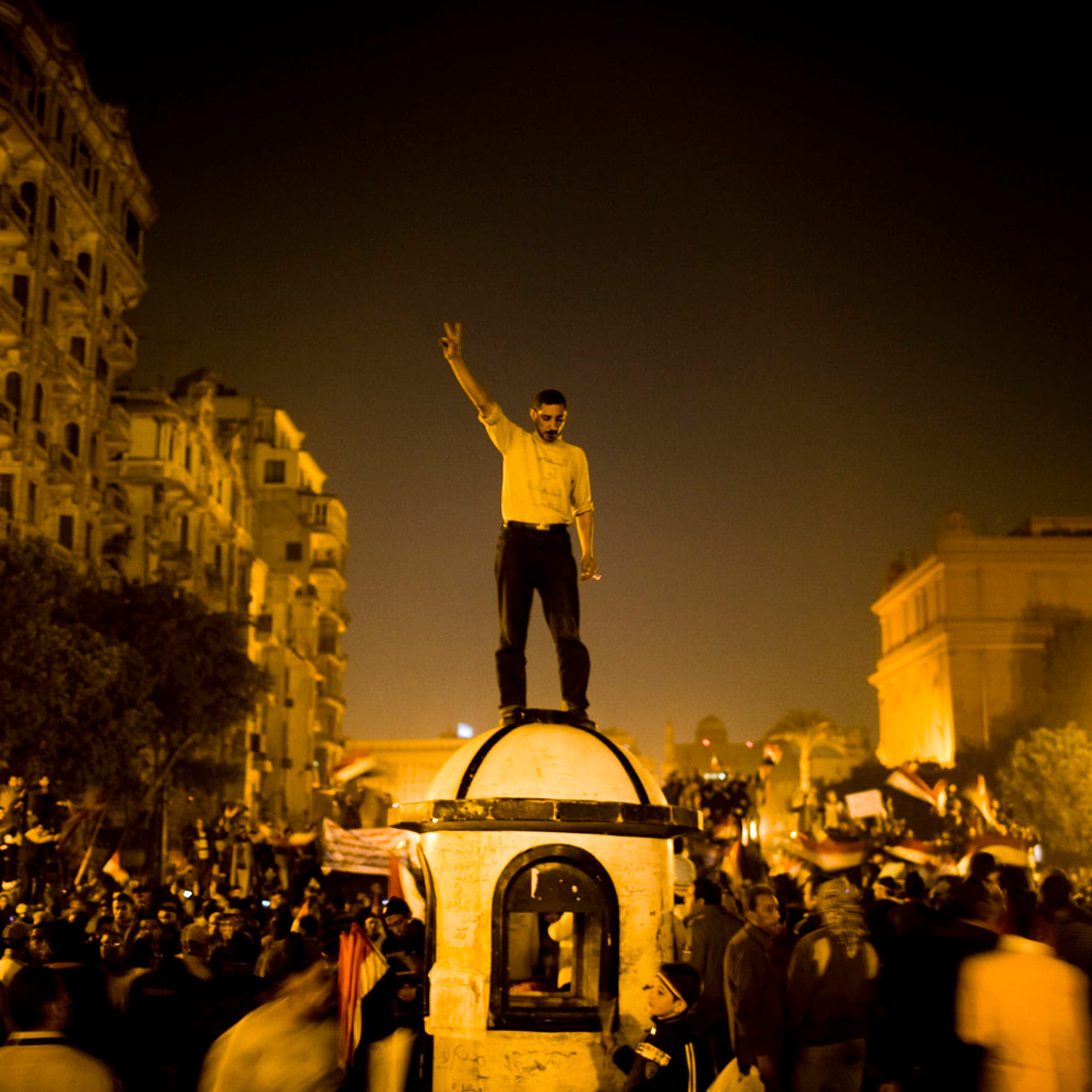 Egypt, Cairo, 2011.
Anti Mubarak protesters after hearing of president Hosni Mubarak's resignation in Tahrir square on Friday.