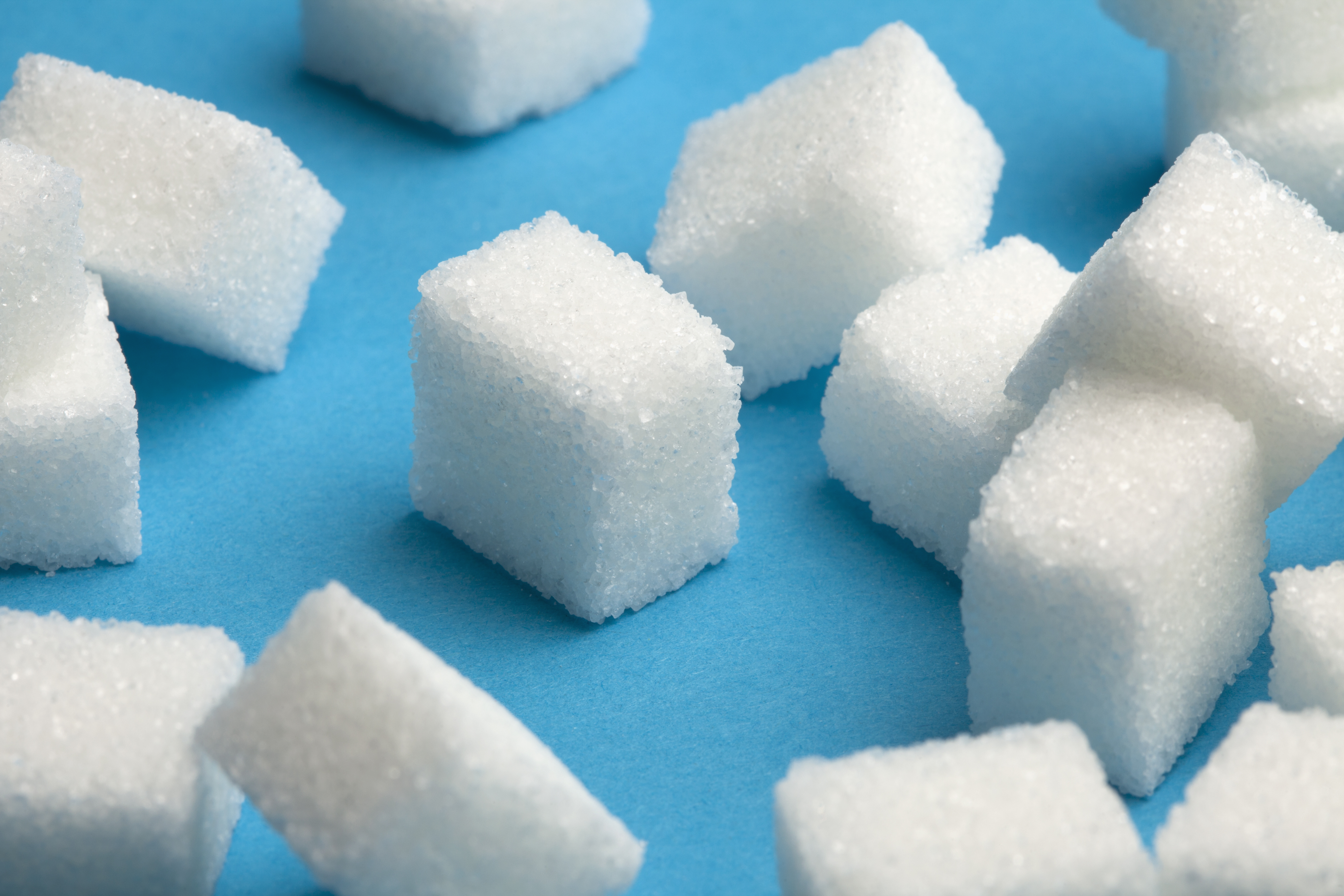 Sugar cubes with one standing out in the middle