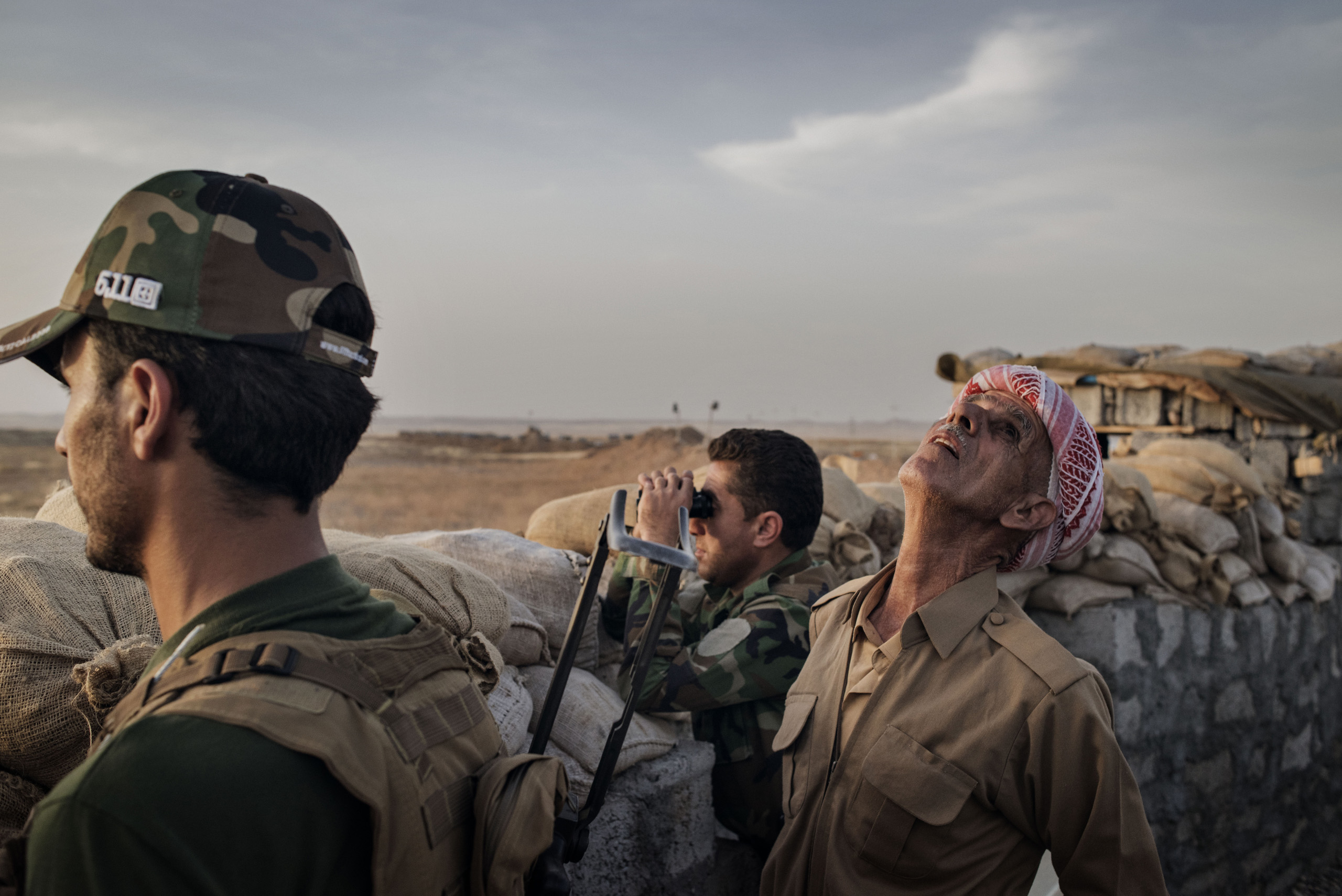 Kurdish Peshmerga forces defend their front line position against ISIS fighters in the northern Iraqi village of Sultan Abdullah, May 15, 2016.