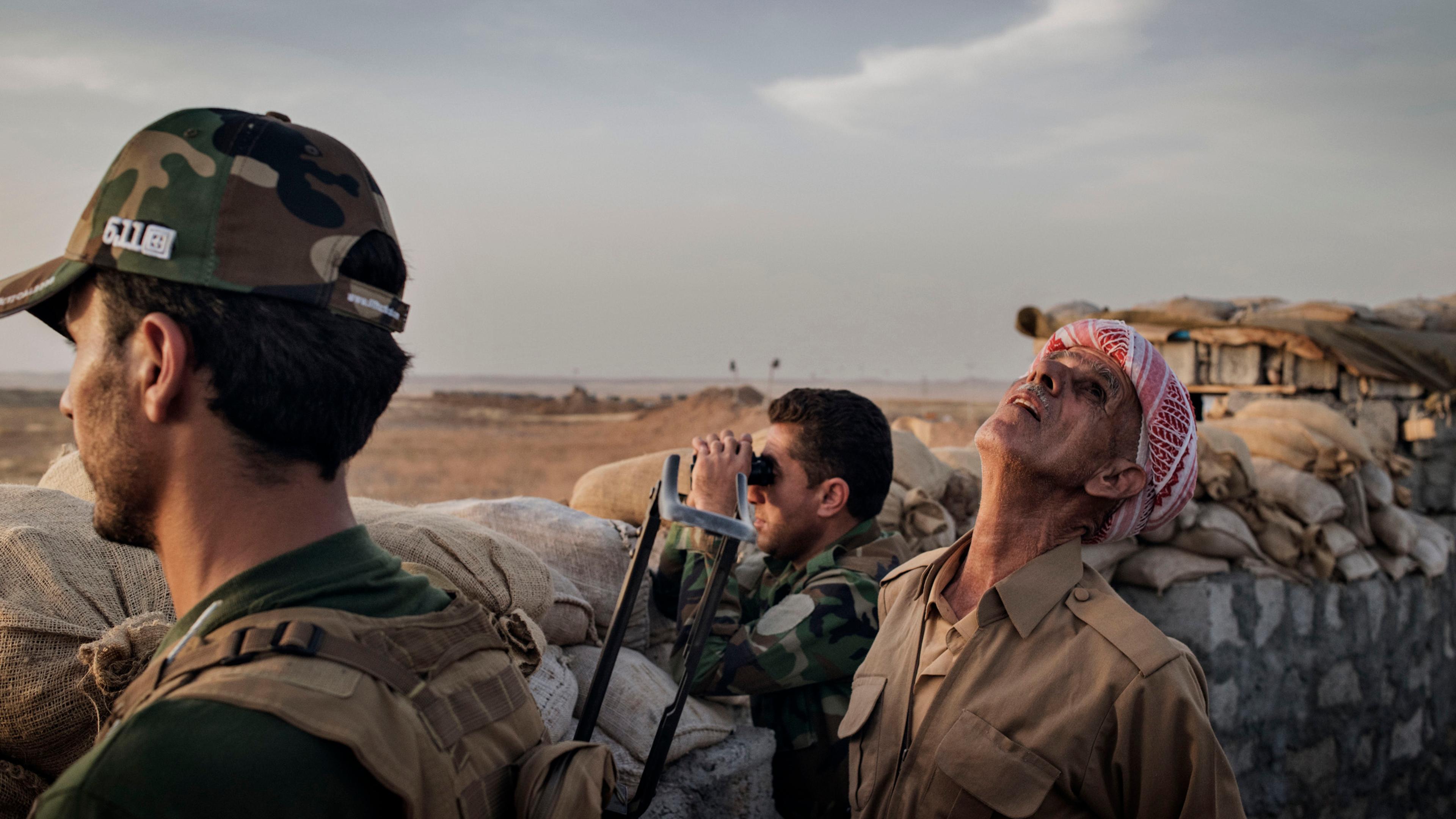 Kurdish Peshmerga forces defend their front line position against ISIS fighters in the northern Iraqi village of Sultan Abdullah, May 15, 2016.