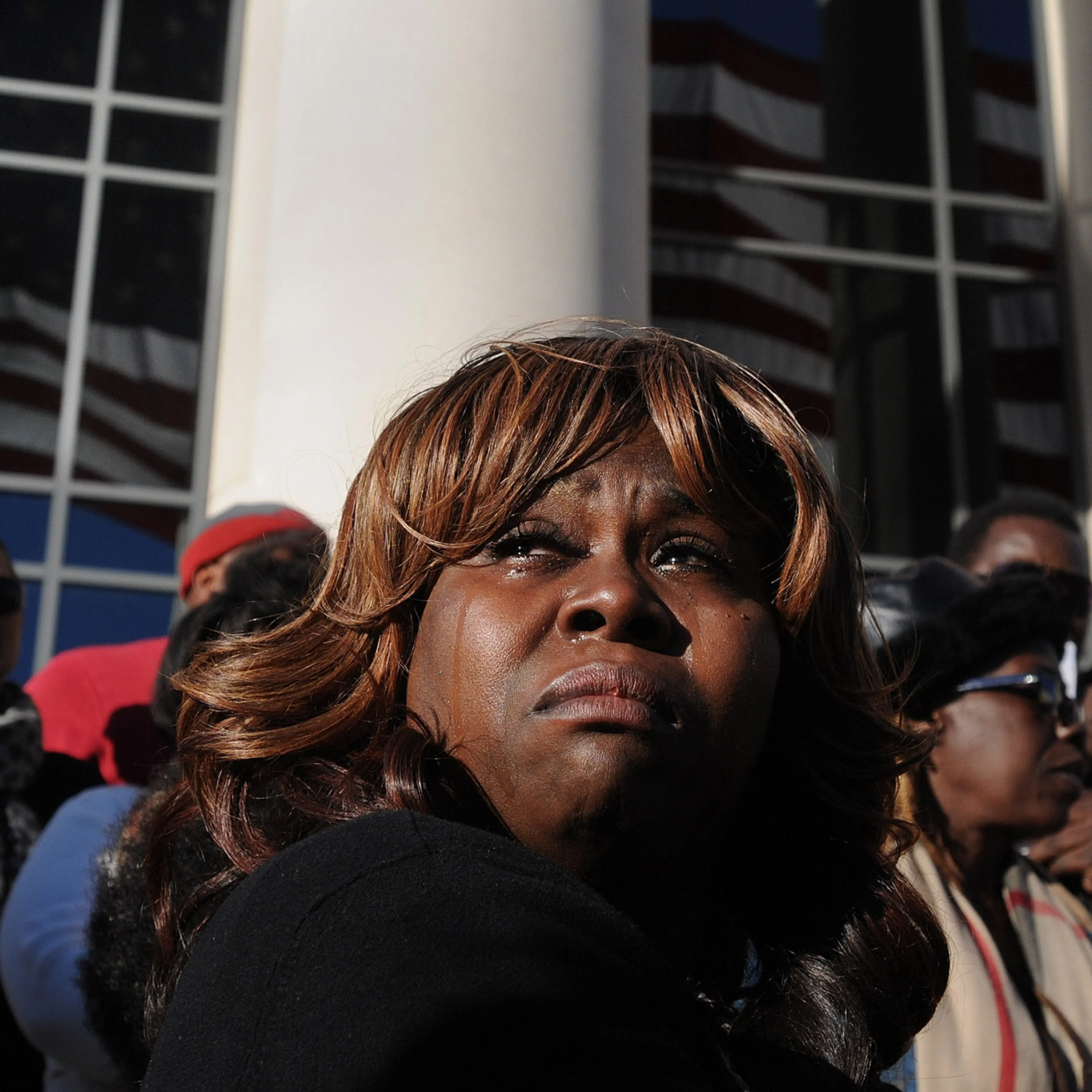 Denise Hunt tears up as she finds out the jury is deadlocked on the first-degree murder charge for Michael Dunn outside of the Duval County Courthouse as the jury enters the fourth day of deliberations, Feb. 15, 2014, in Jacksonville, Fla.