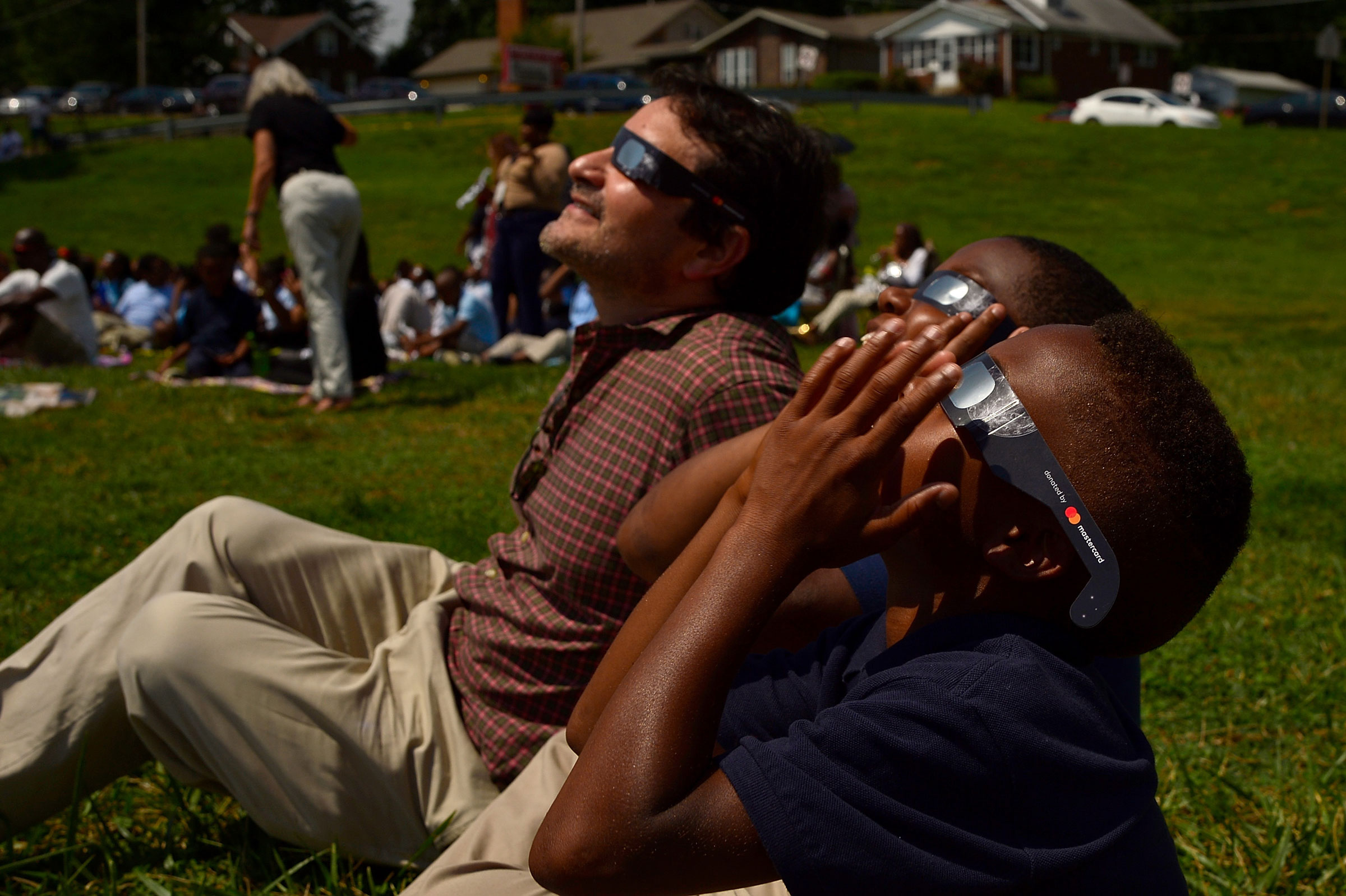 Students view the solar eclipse in St. Louis, on August 21, 2017.