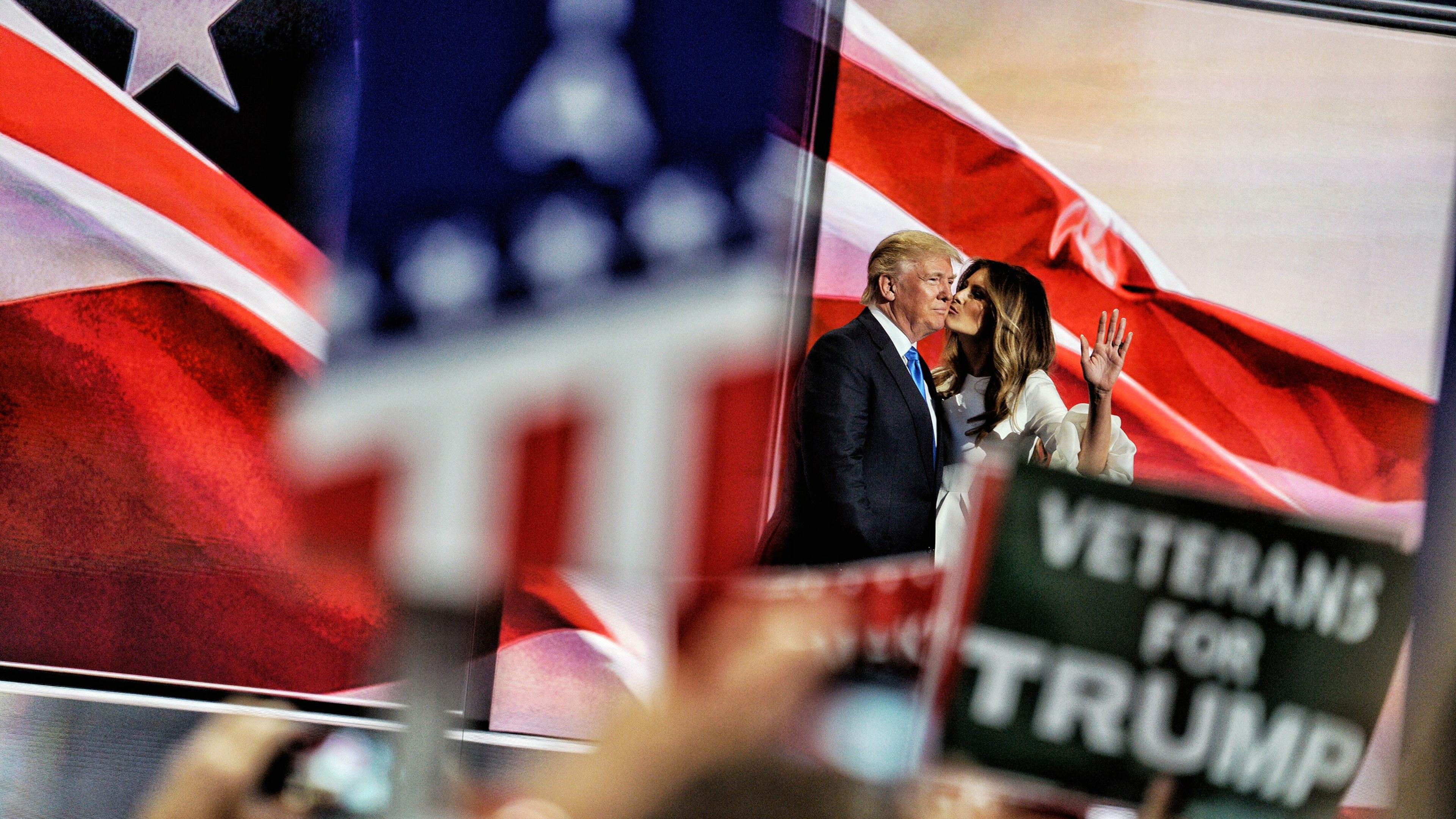Melania Trump kisses her husband, Republican presidential candidate Donald Trump, to the applause of the ecstatic crowd, on July 18, 2016.