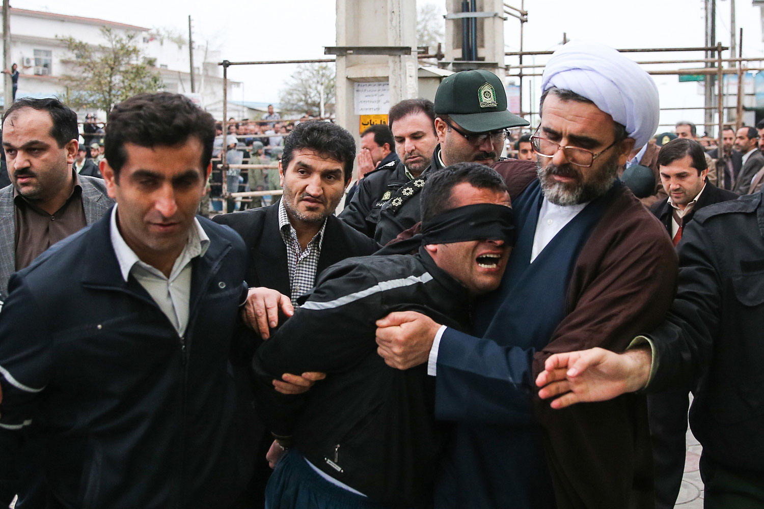 Balal, who killed an Iranian youth Abdolah Hosseinzadeh in a street fight with a knife in 2007, is brought to the gallows during his execution ceremony in the northern city of Nowshahr on April 15, 2014.