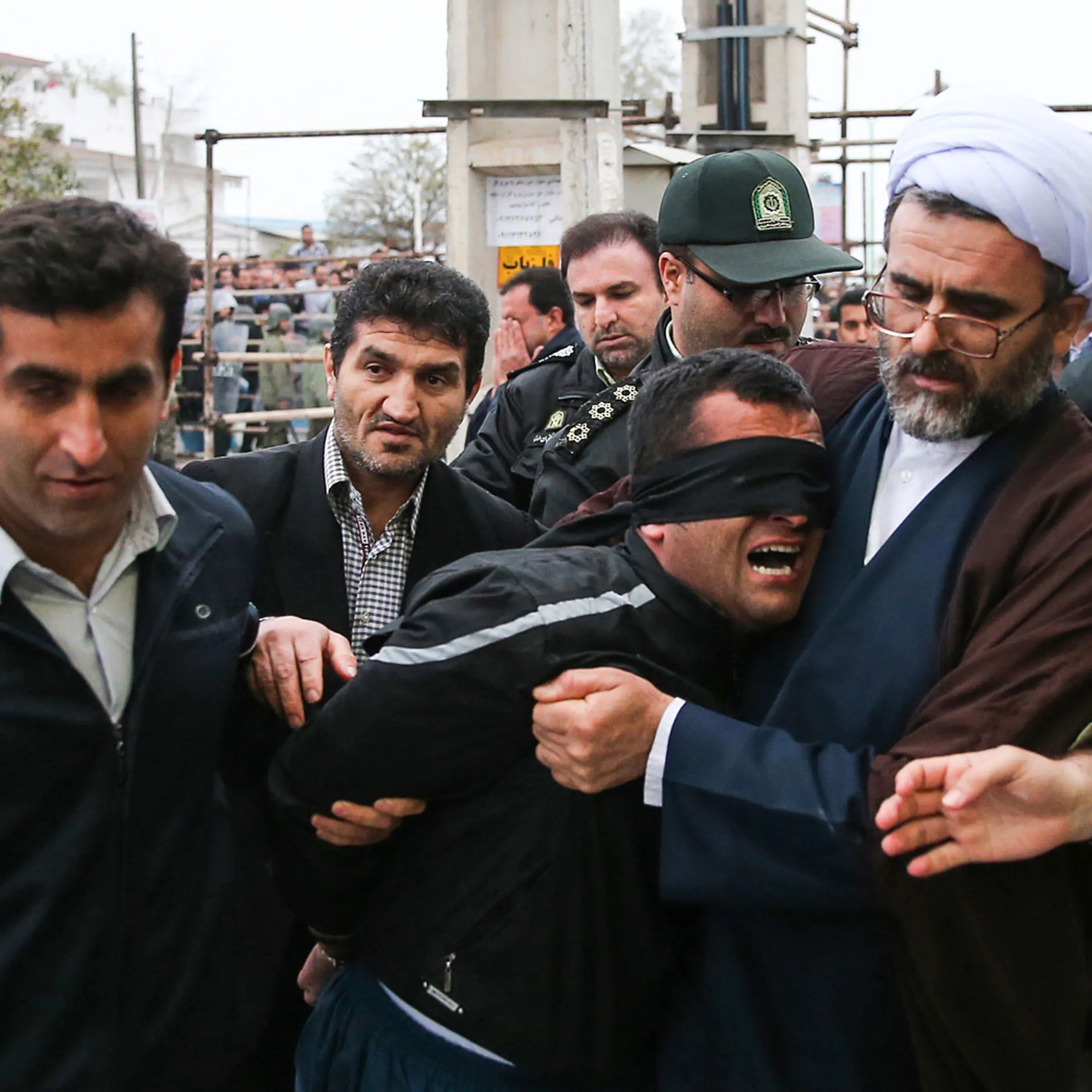 Balal, who killed an Iranian youth Abdolah Hosseinzadeh in a street fight with a knife in 2007, is brought to the gallows during his execution ceremony in the northern city of Nowshahr on April 15, 2014.