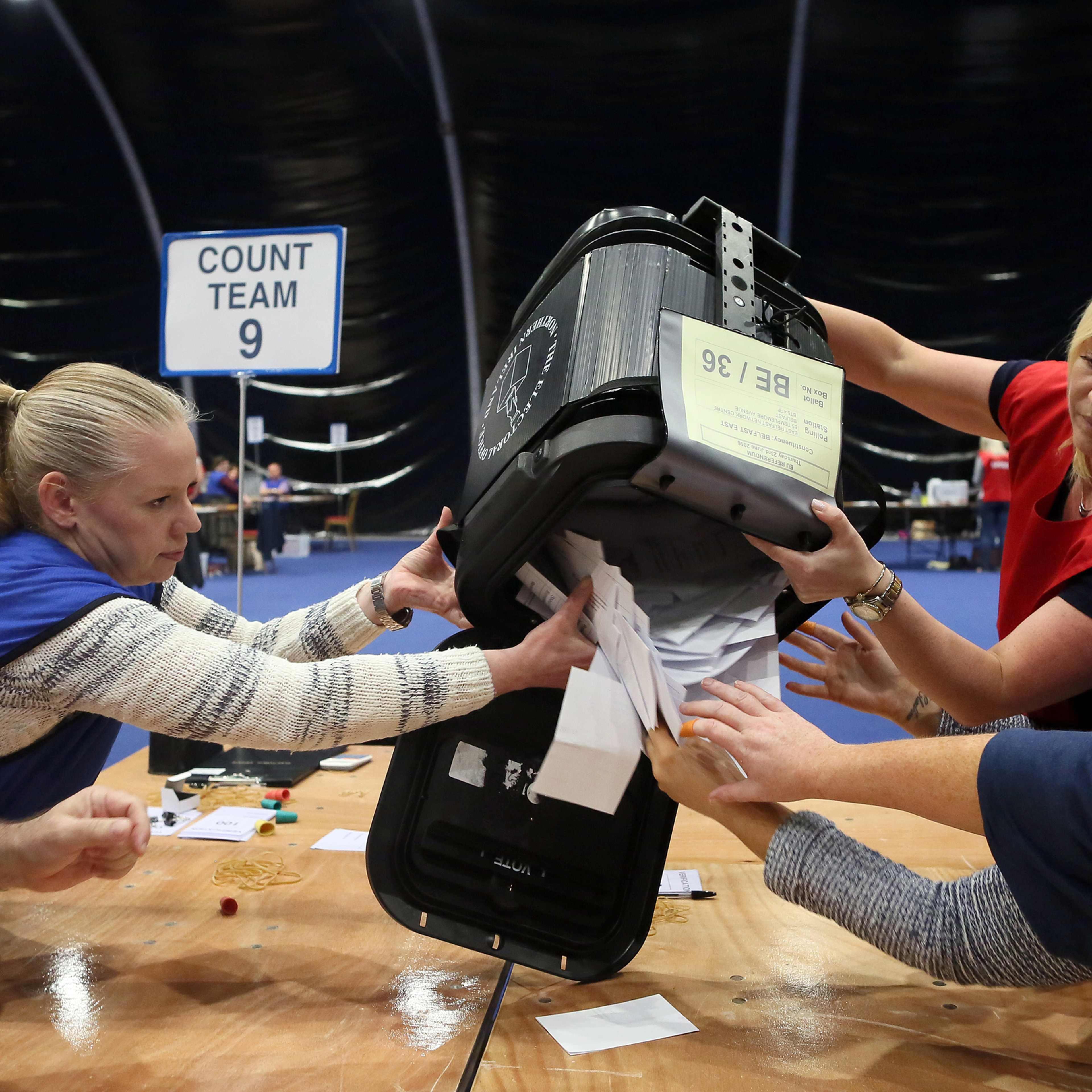The first Ballot boxes are opened at the Titanic Exhibition centre, the Belfast count centre after polls closed in the referendum on whether the UK will stay in the European Union on June 23, 2016.