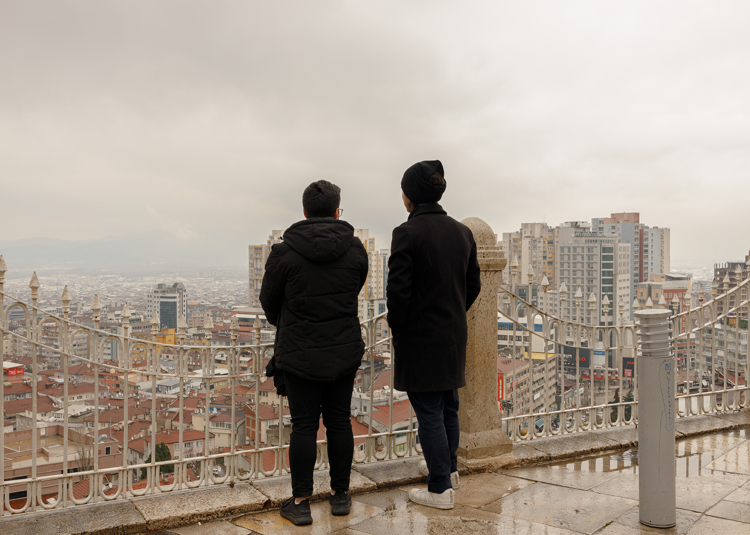 Mehdi*, 23, and Samir*, 24, originally from Aleppo and based in Gaziantep, Turkey, look out at Bursa, a city close to Istanbul where the two brothers found refuge after the Turkish government granted 60-days travel permission to Syrians under temporary protection, in April. (Their names have been changed.) The $500 provided by the government to all affected families also helped Mehdi and Samir to temporarily move away from their adopted city, while the aftershocks continued. 