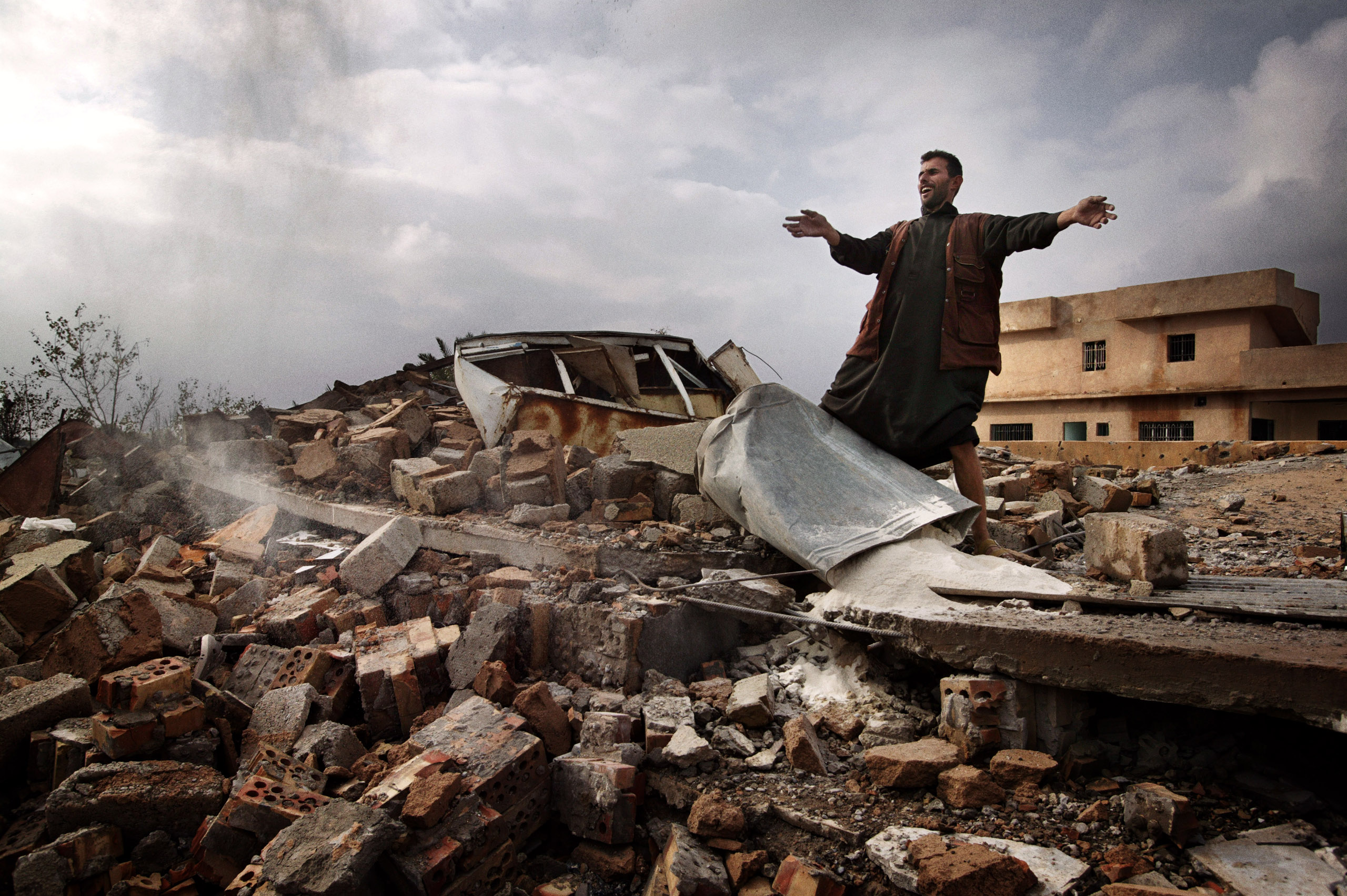 Laith Klabos stands on the ruins of his home in Boasil village across the Tigris from Tikrit. The house was demolished by American soldiers, November 2003.
