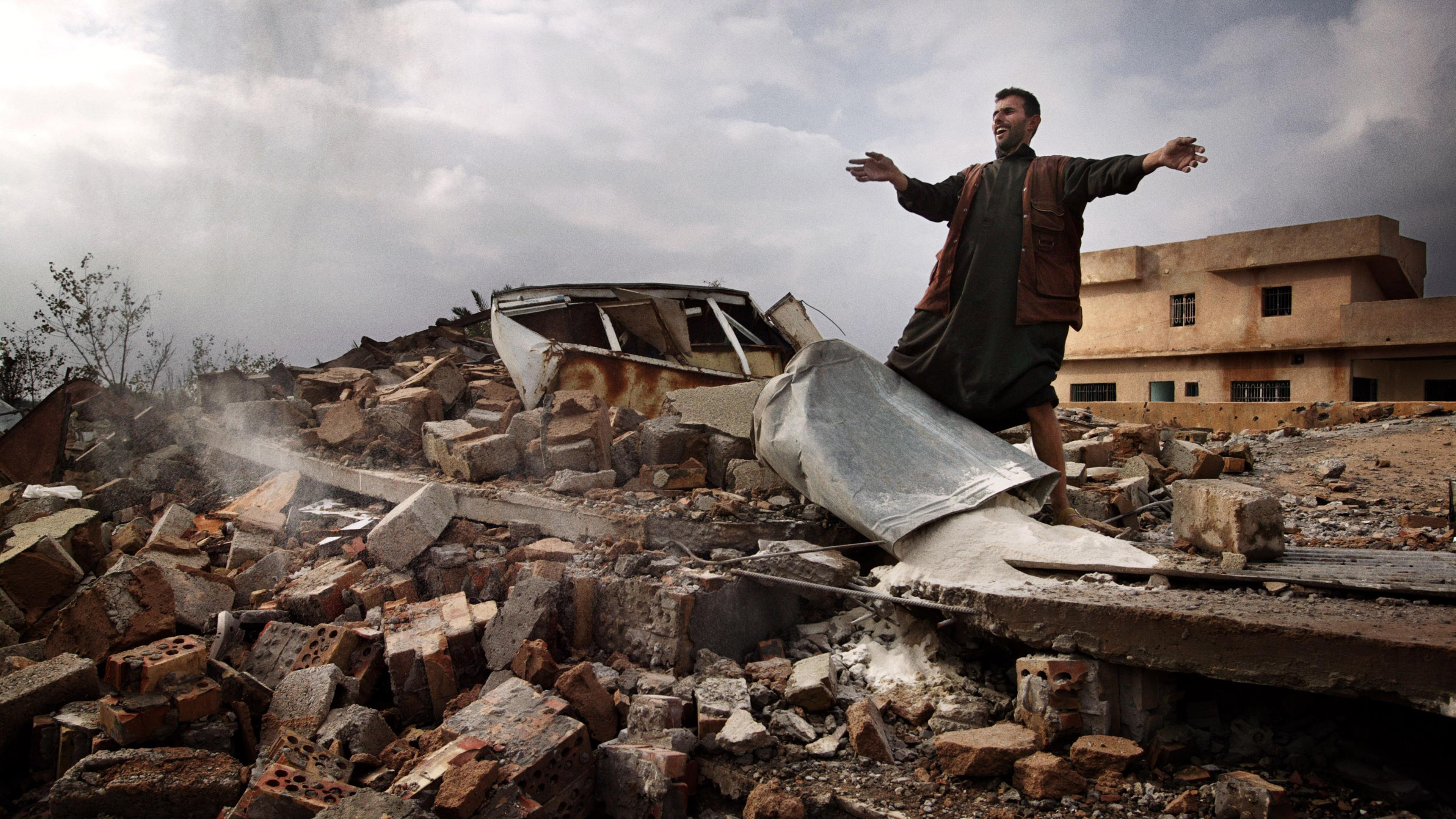 Laith Klabos stands on the ruins of his home in Boasil village across the Tigris from Tikrit. The house was demolished by American soldiers, November 2003.