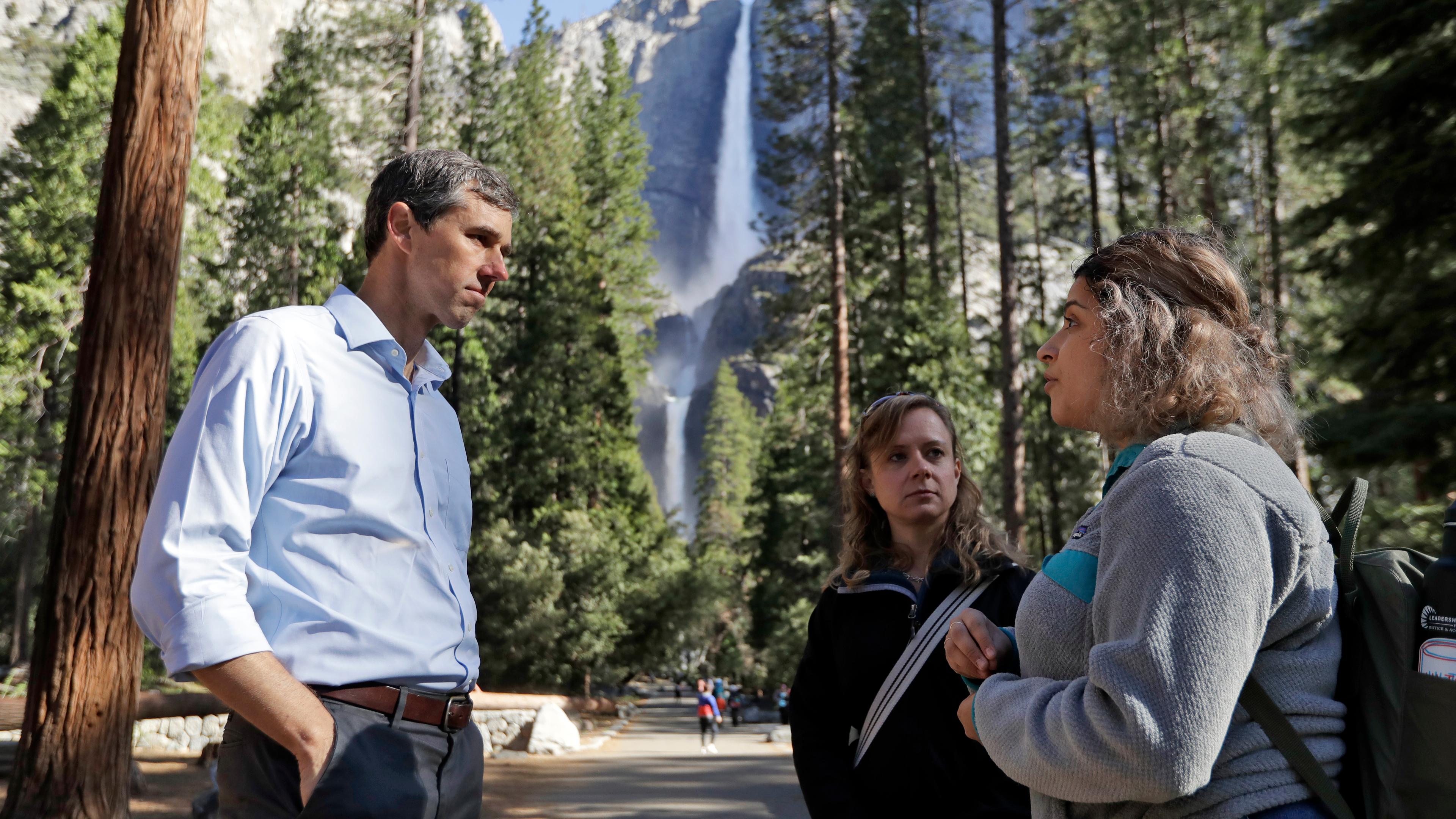 Democratic presidential candidate and former Texas congressman Beto O'Rourke, left, talks with Anne Kelly, center, Director of the Sierra Nevada Research Stations and environmental advocate Leslie Martinez center, Monday, April 29, 2019, in Yosemite Nati