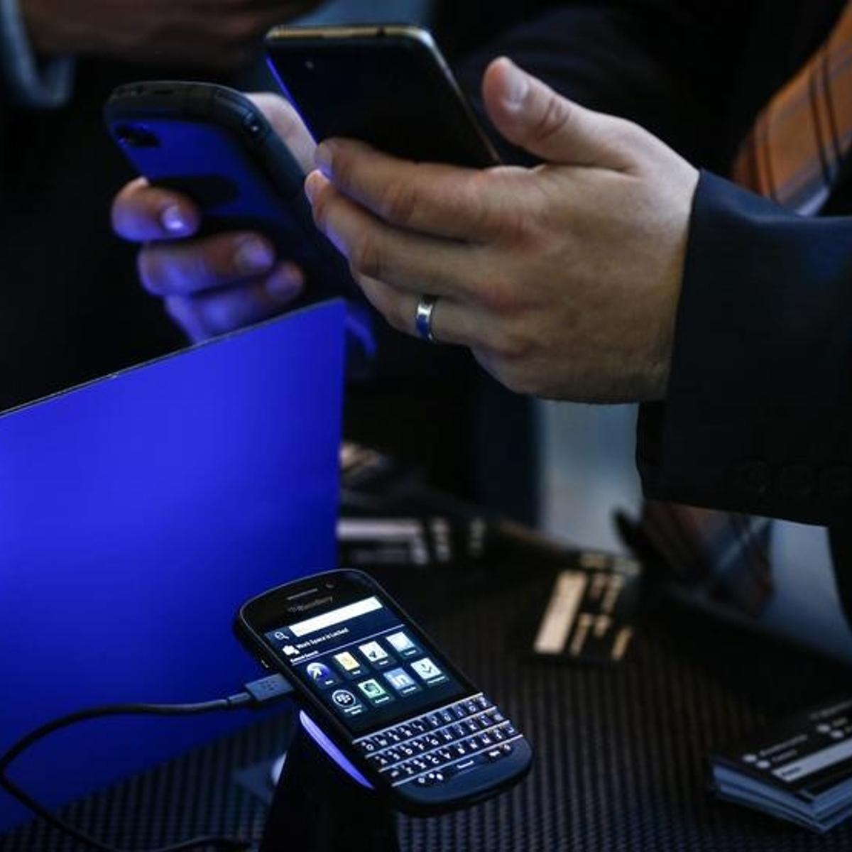 A Blackberry Q10 handset is seen on display as people use their devices at the Fairfax Holdings annual general meeting for shareholders in Toronto