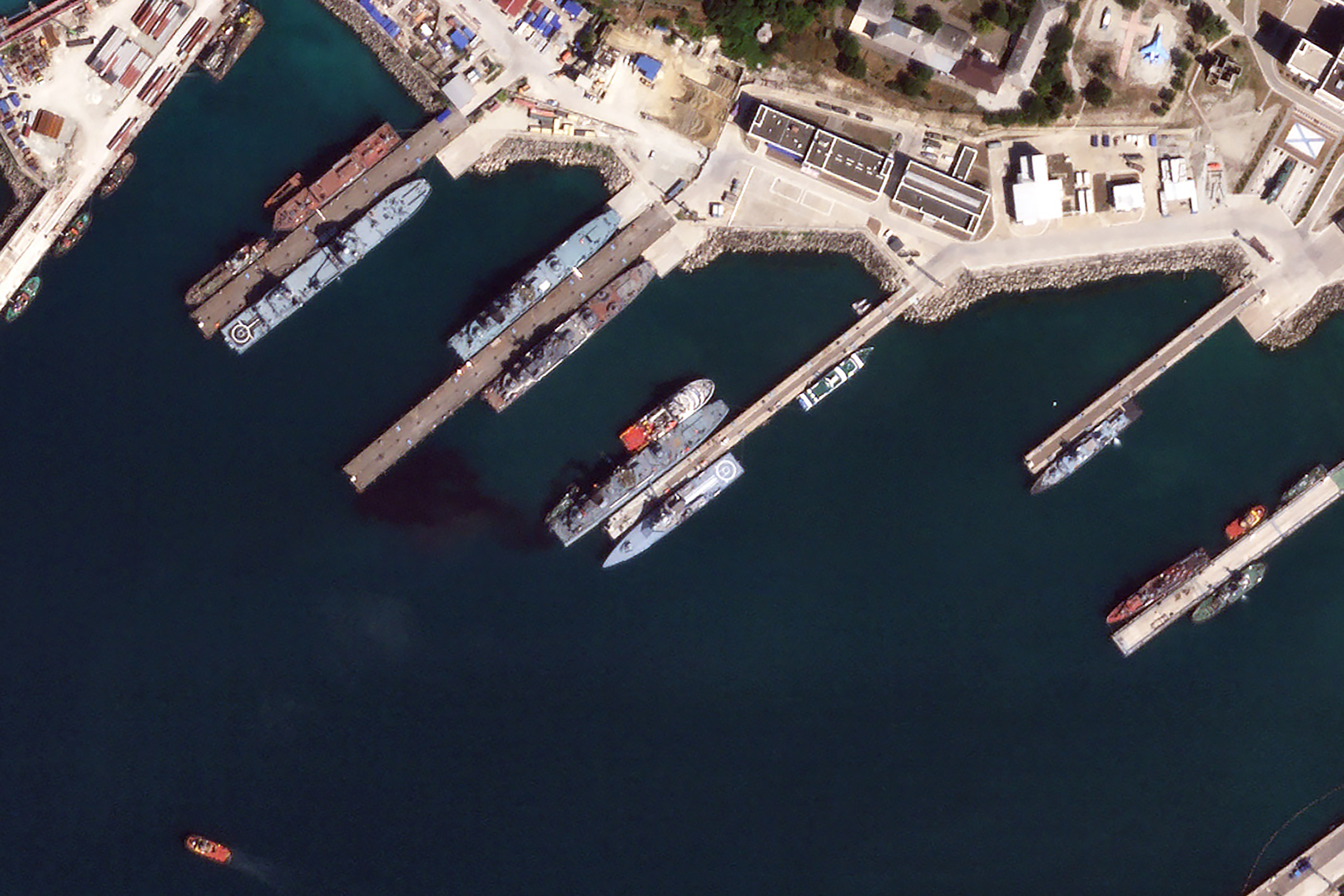 This satellite photo appears to show the damaged Russian landing vessel Olenegorsky Gornyak leaking oil while docked at Novorossiysk, Russia, on Aug. 4, 2023.