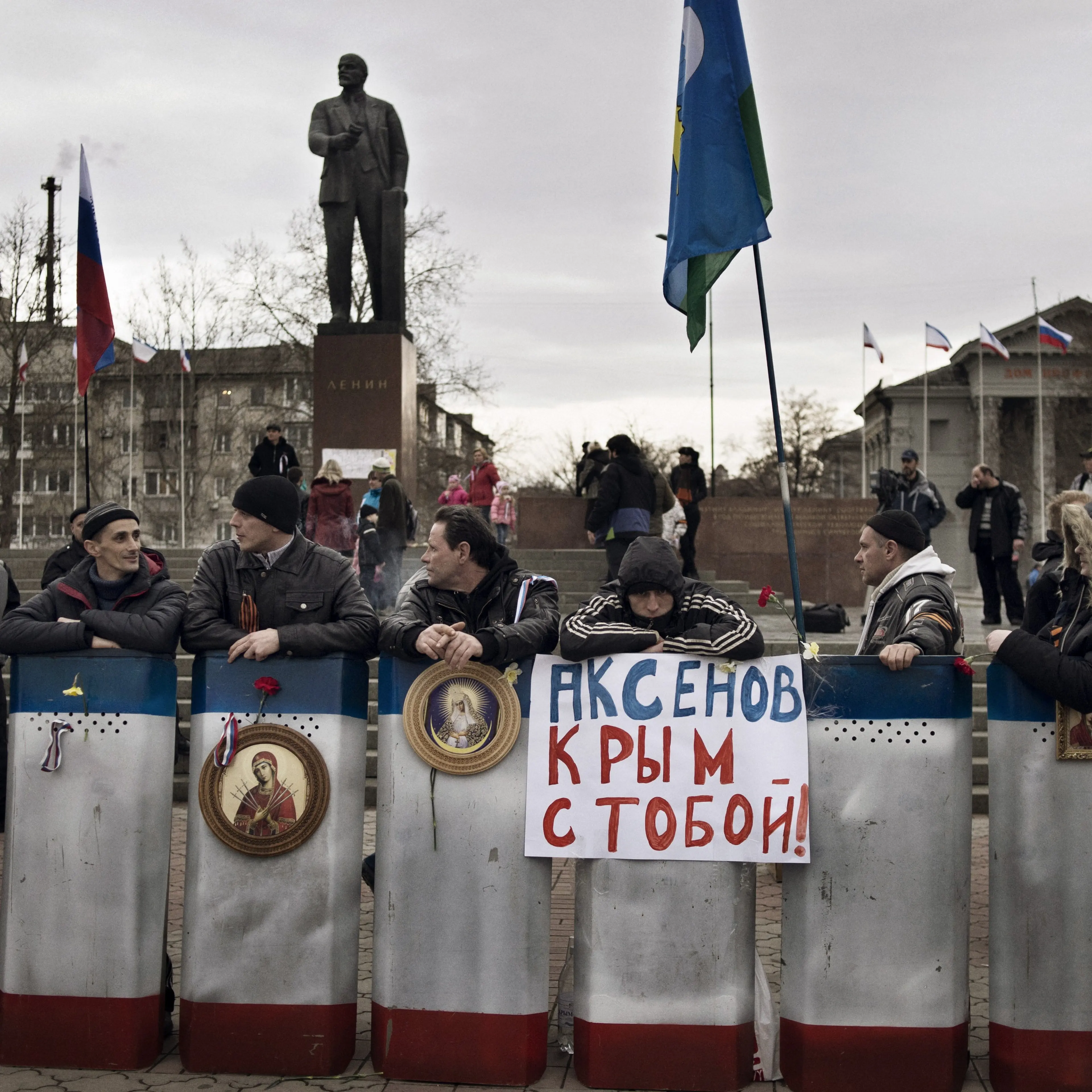 Members of a pro-Russian group stationed themselves in front of government buildings and a statue of Lenin in Simferopol on Sunday.