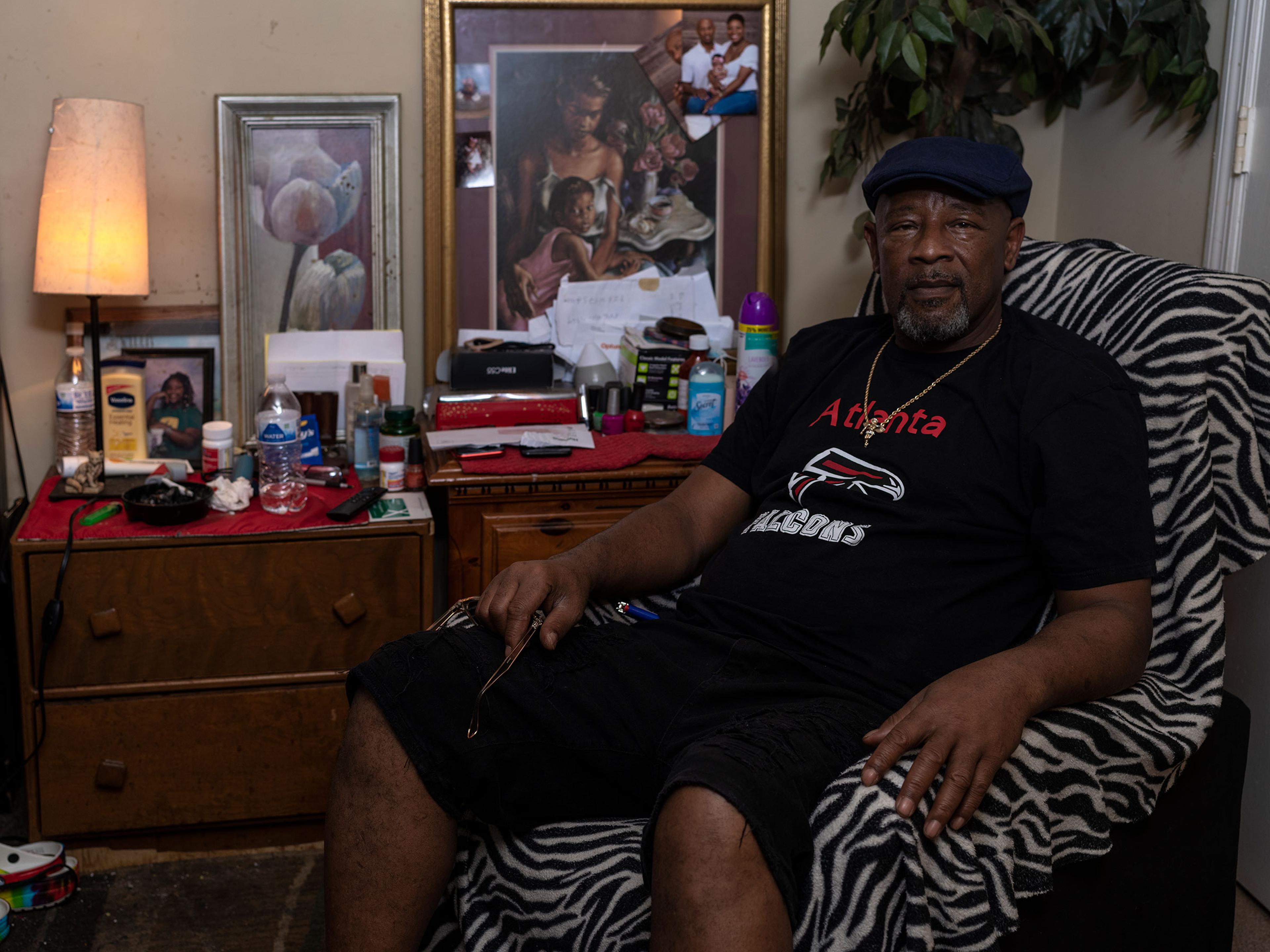 Keith Bowens poses for a portrait in his home in Lithonia, Ga. on Nov. 6.