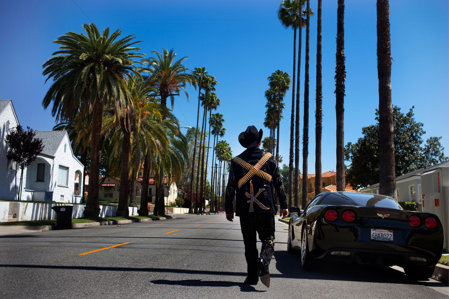 <b>El Komander</b><br>
Alfredo "El Komander" Rios walks down a street in Burbank, Calif., near the office of his agent and producer, Twiins Enterprises. One of the hottest <i>narcocorrido</i> talents in the industry, El Komander regularly performs at private parties for Sinaloa's cartel members and composes songs for and about them
